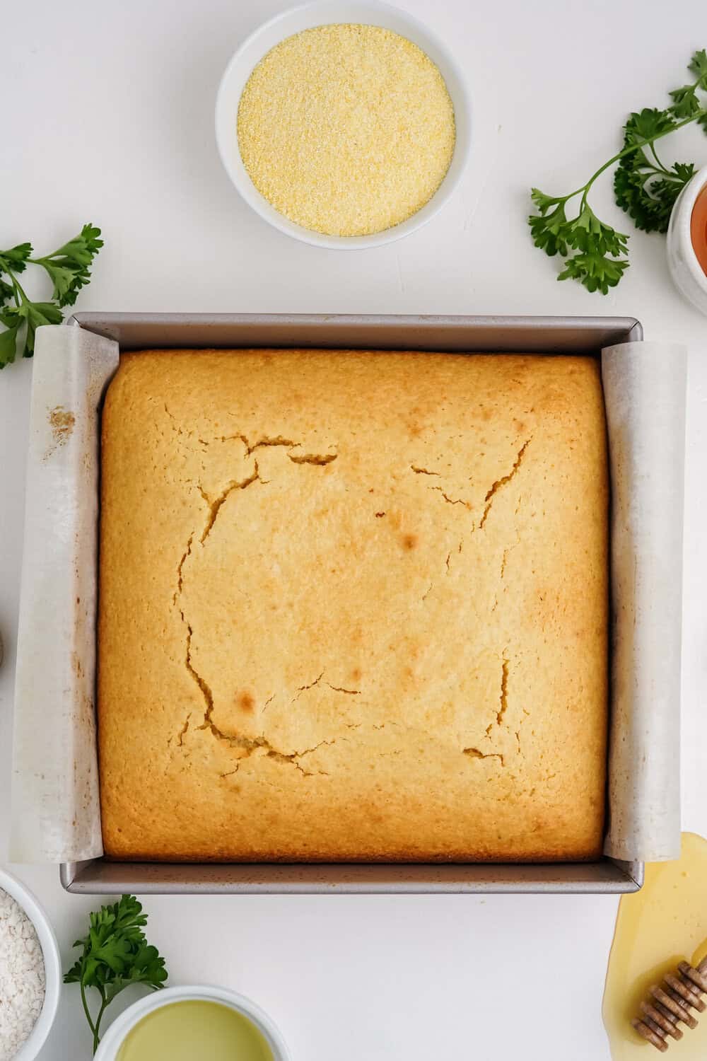 baked honey cornbread in square baking pan