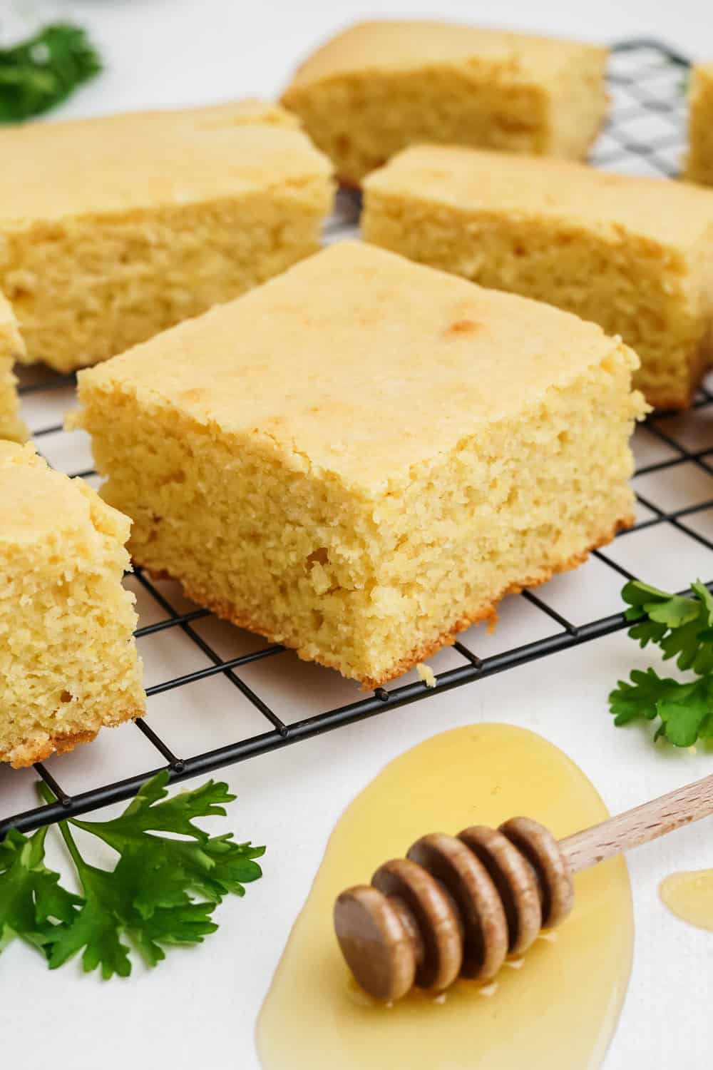 squares of honey cornbread on a cooling rack