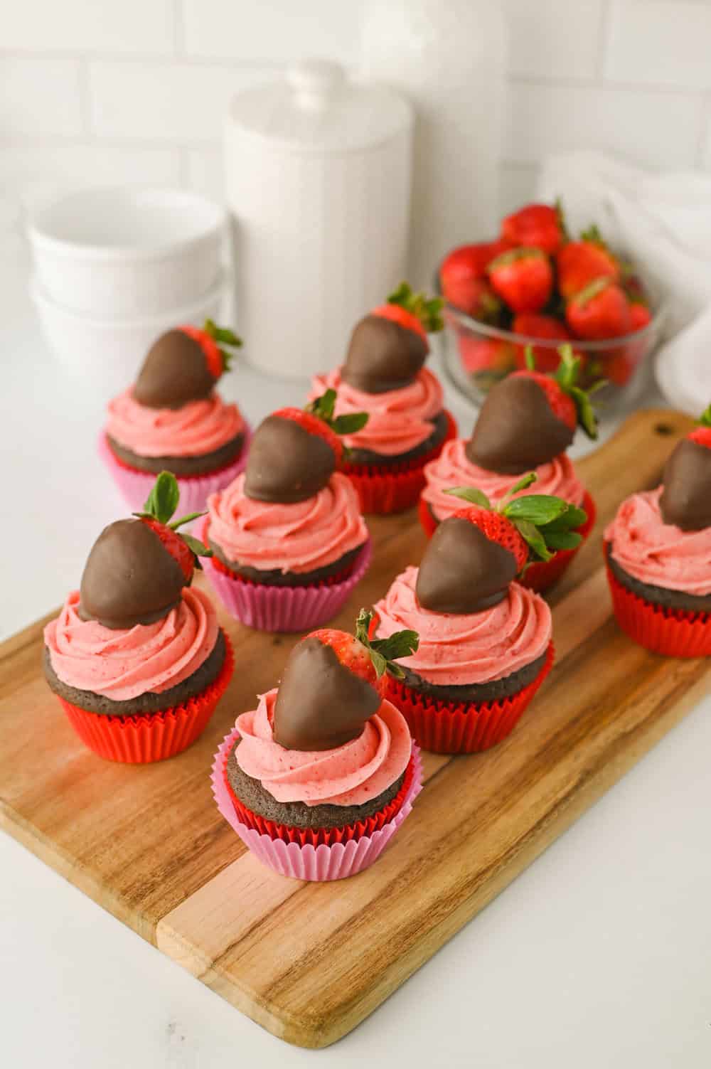 Chocolate Covered Strawberry Cupcakes on a cutting board