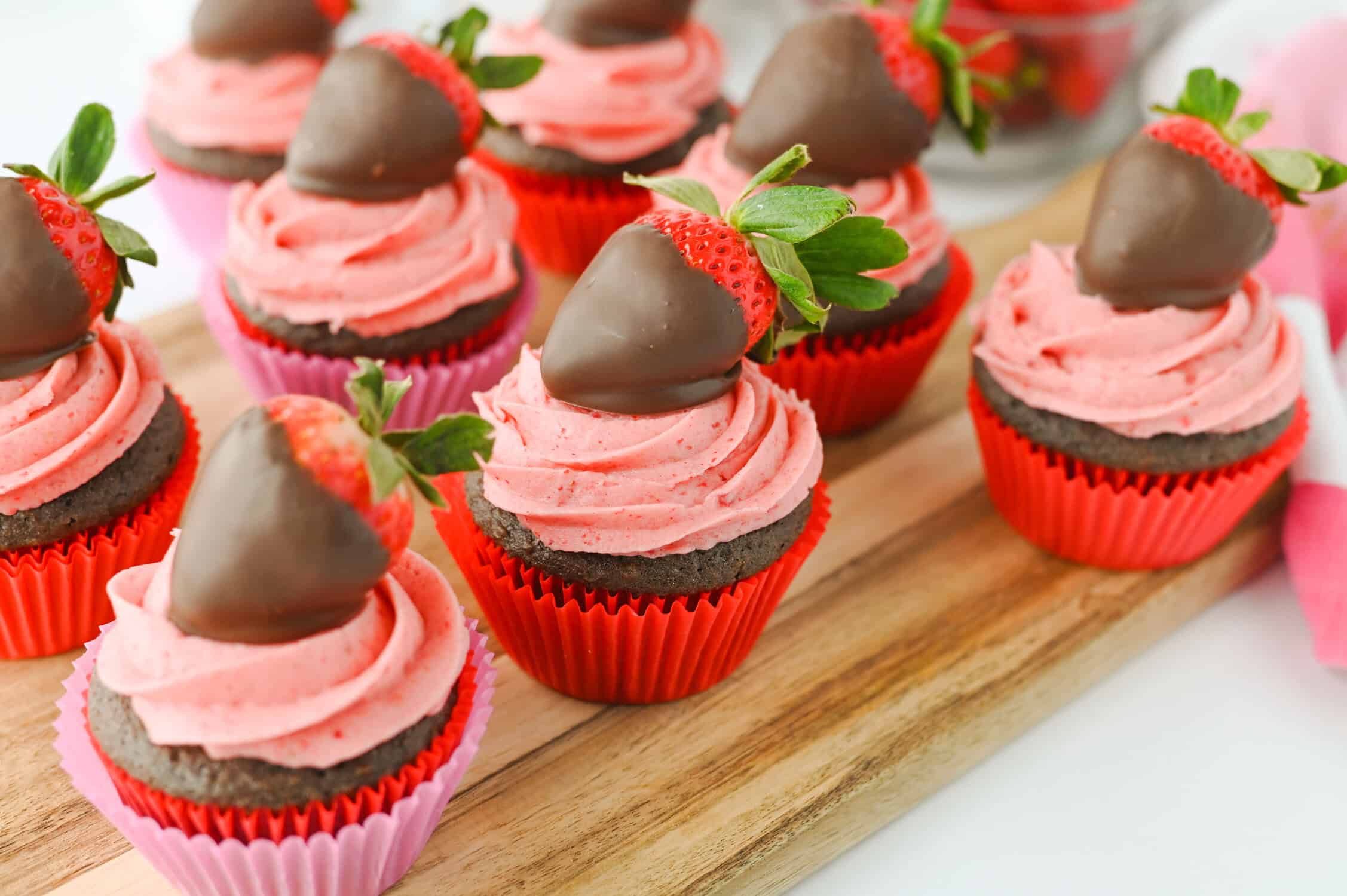 Chocolate Covered Strawberry Cupcakes on a cutting board