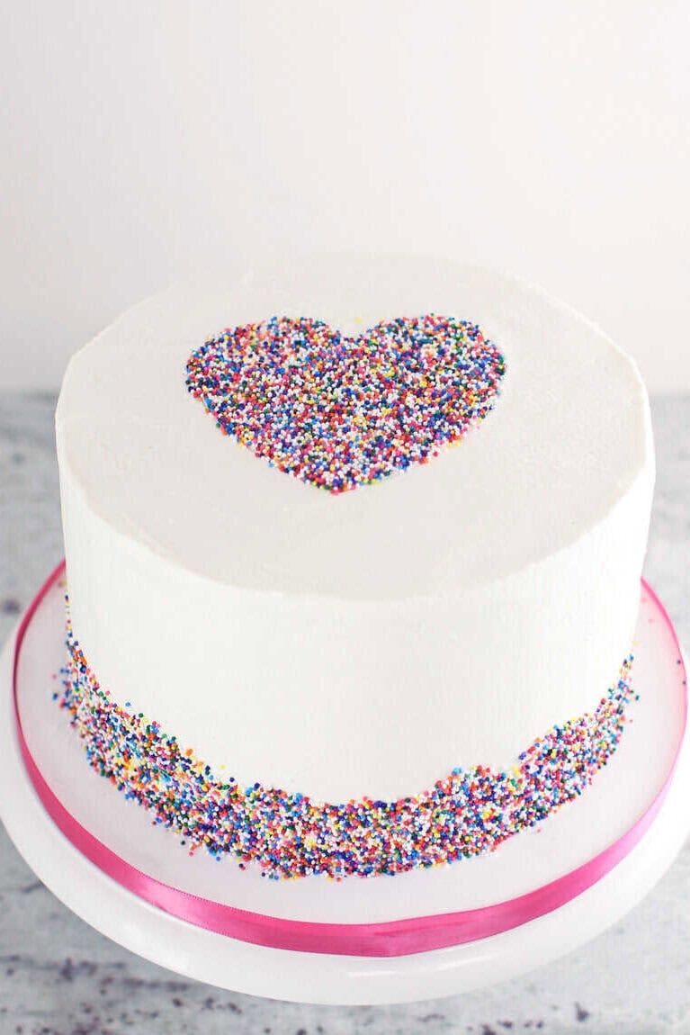 buttercream cake with heart made from sprinkles