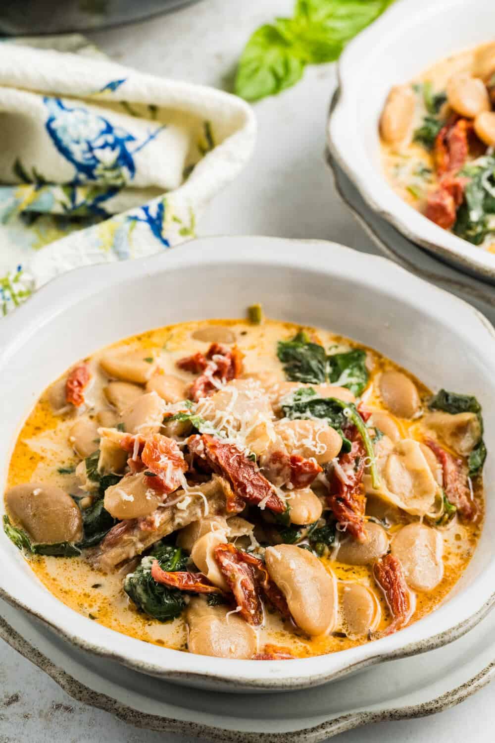 a small white bowl of marry me butter beans