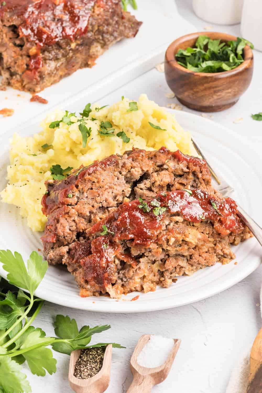 meatloaf with oatmeal on a plate with mashed potatoes