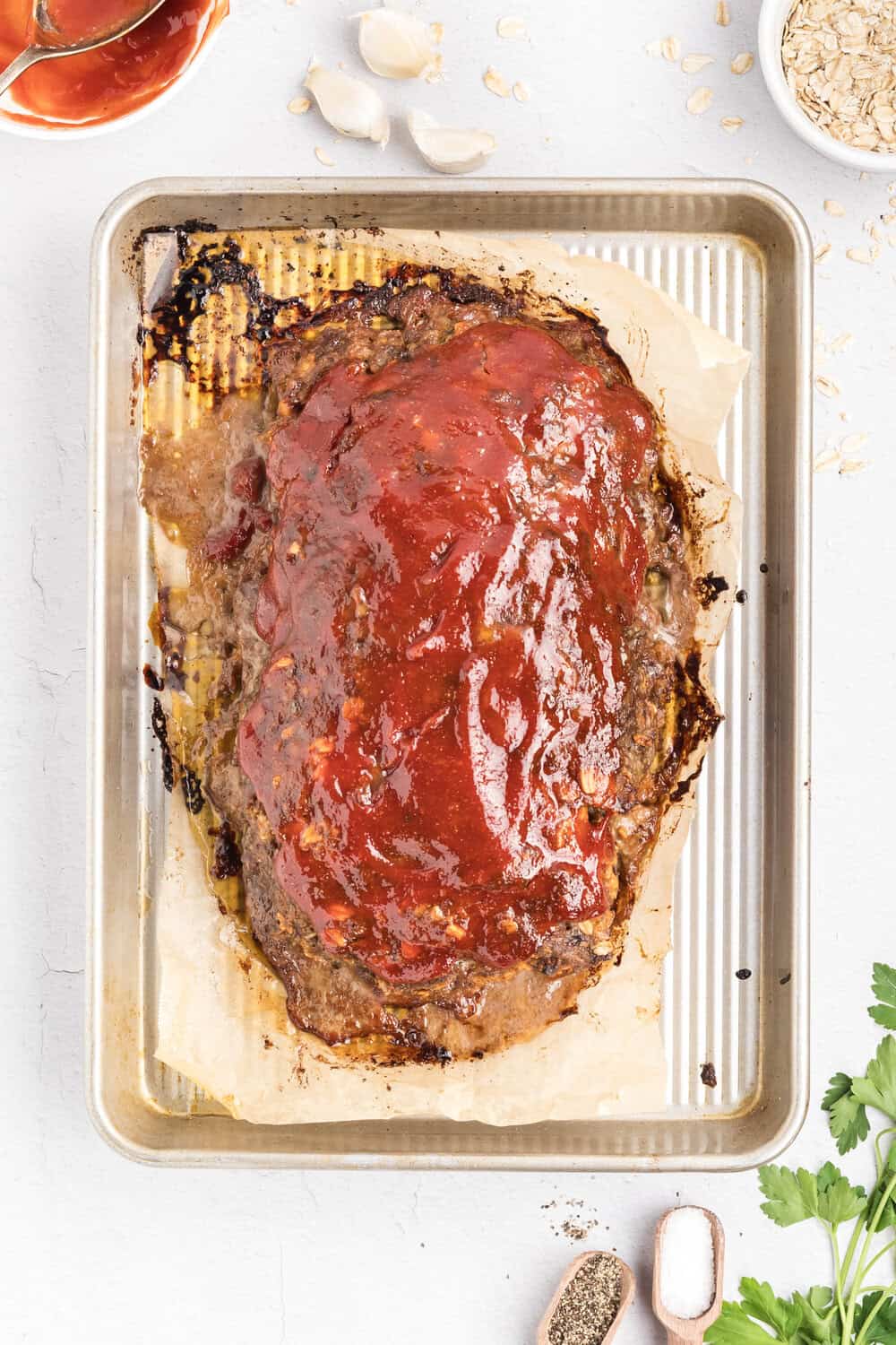 baked meatloaf covered in sauce