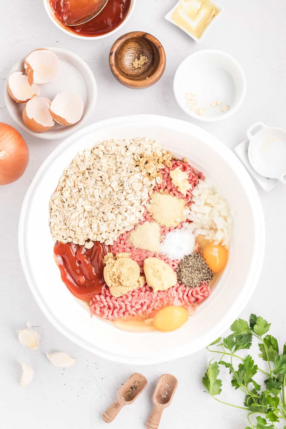 all ingredients for the meatloaf in a mixing bowl