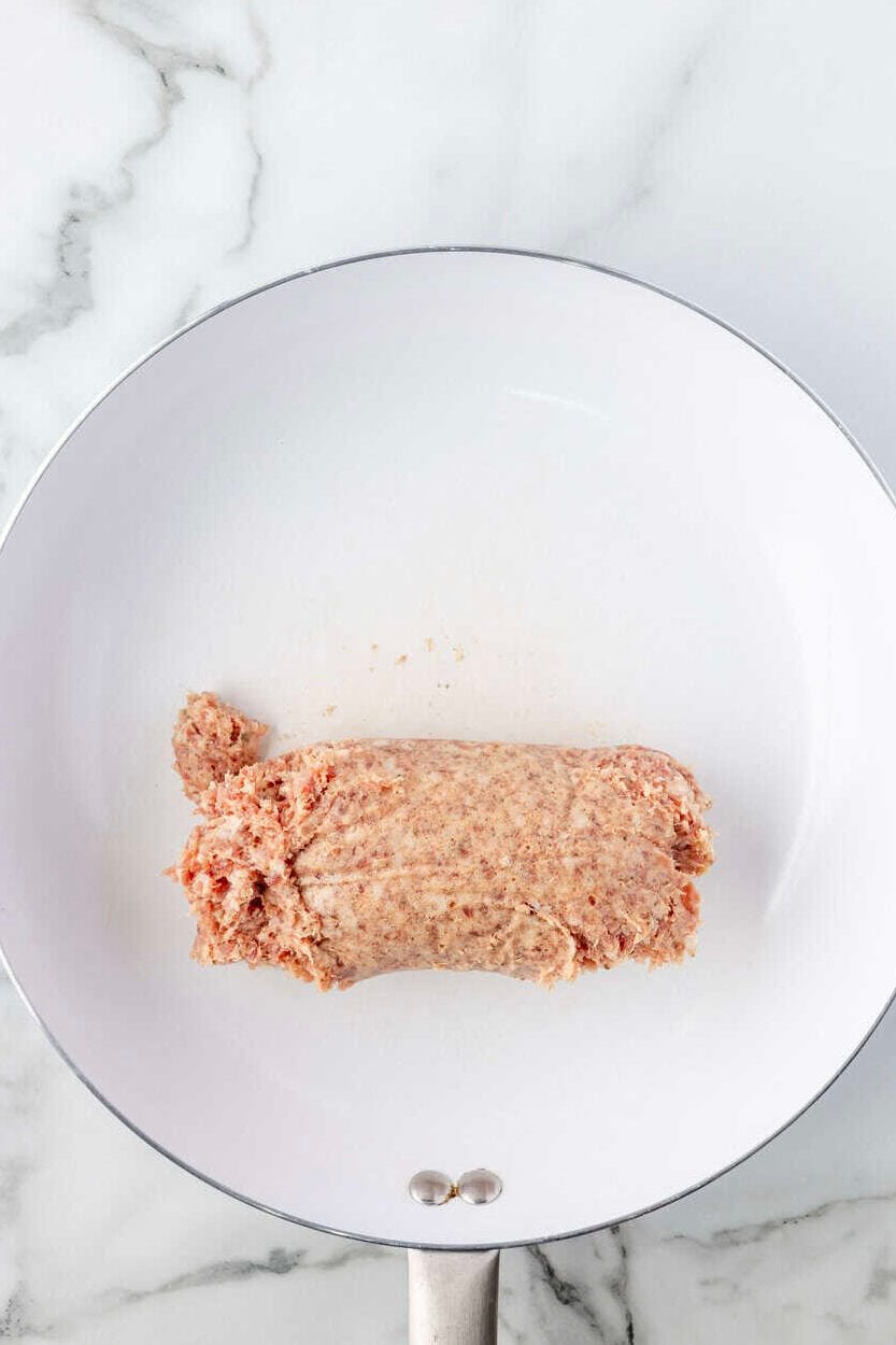 raw breakfast sausage in a skillet