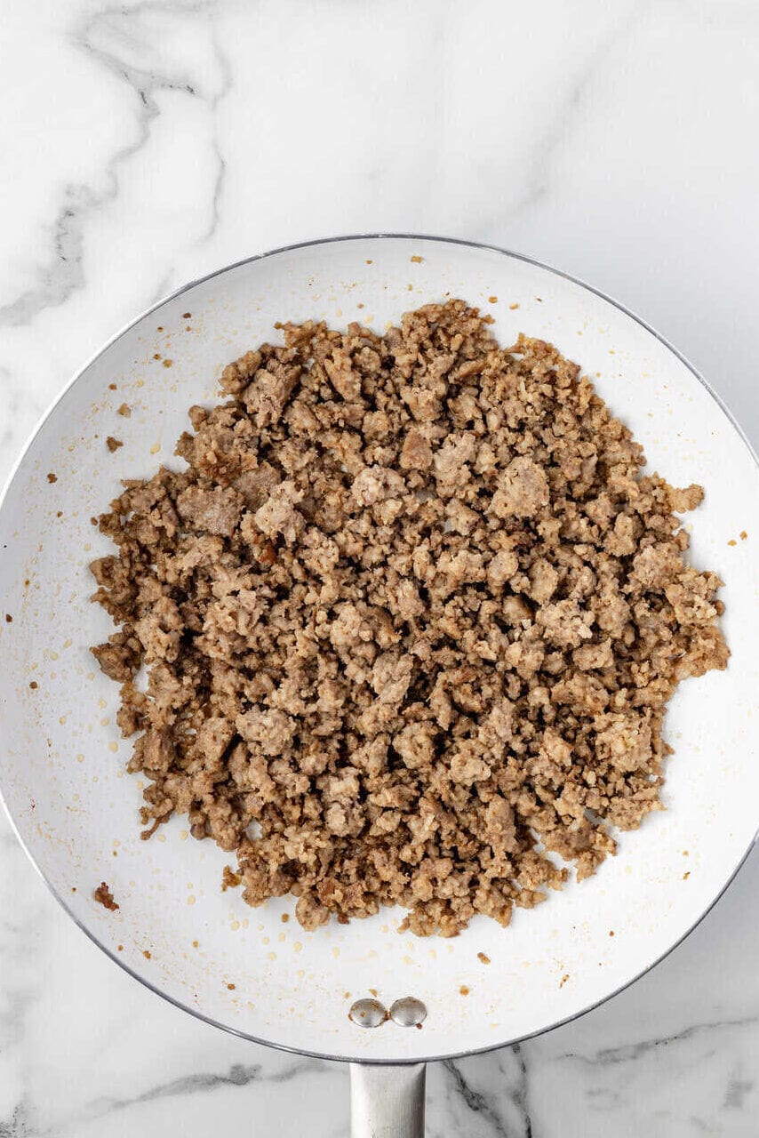 browned crumbled sausage in a skillet