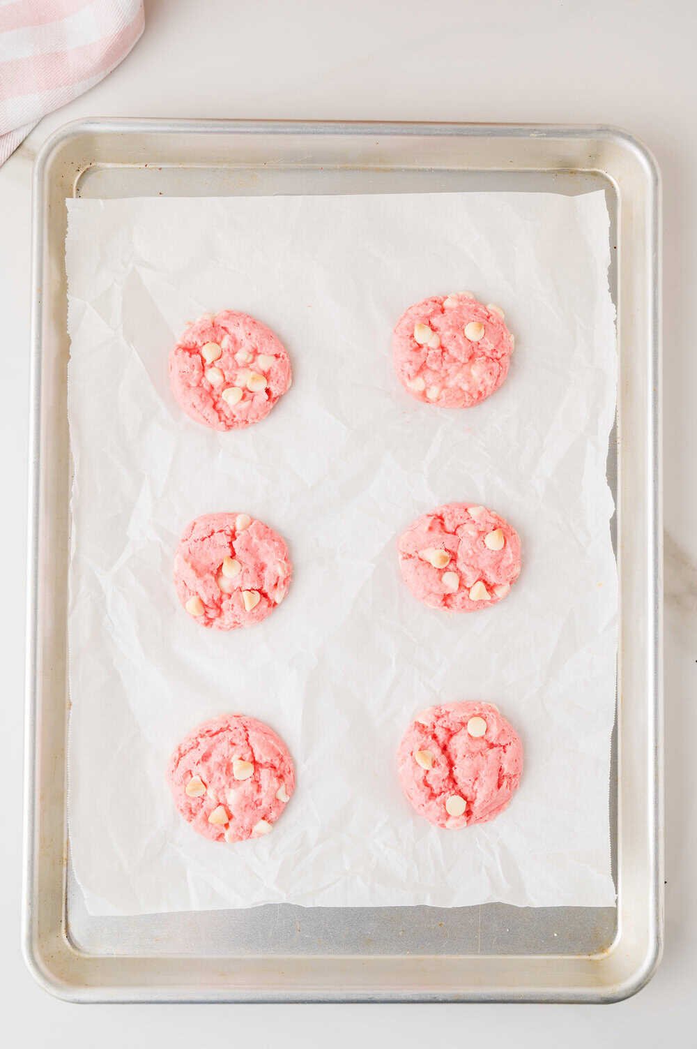 baked cookies on a baking sheet lined with parchment paper