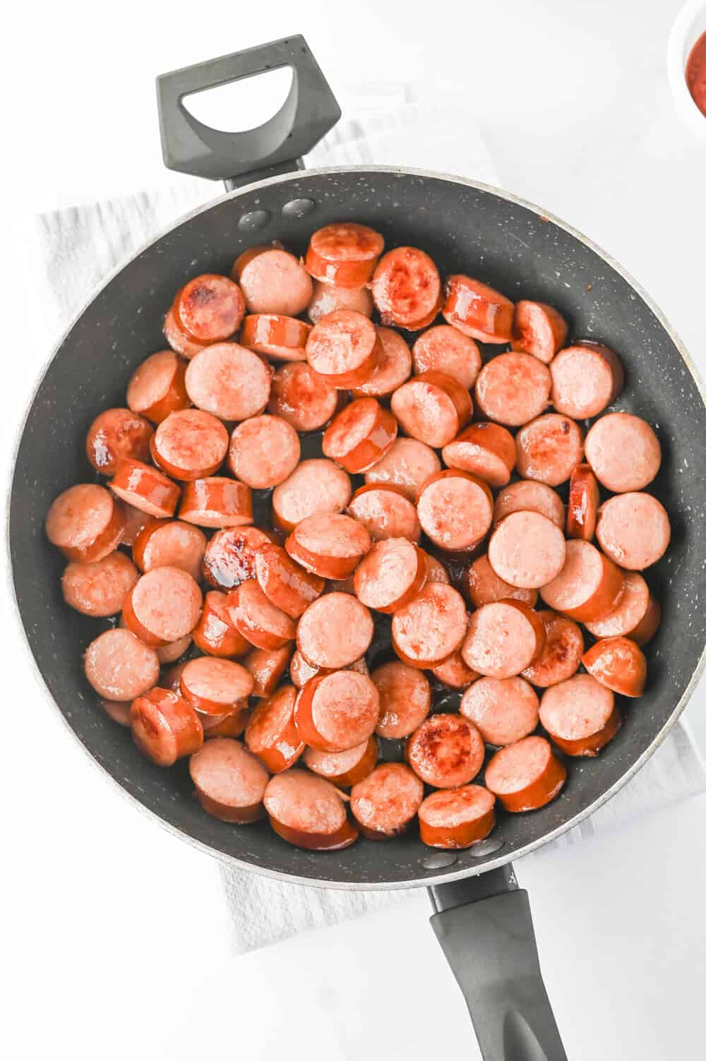 sliced kielbasa in a skillet