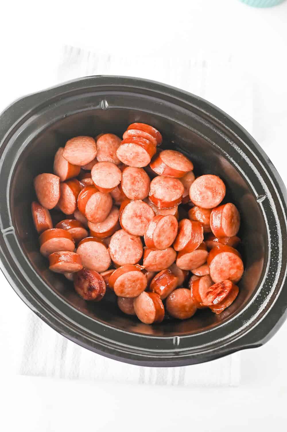 sliced kielbasa in a crock pot