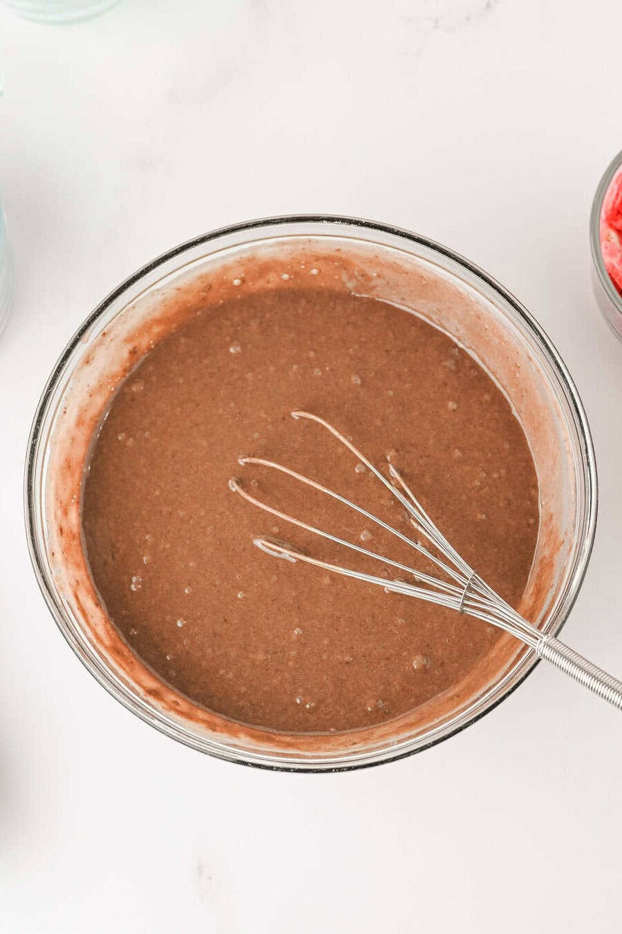 chocolate cake mix batter in clear mixing bowl