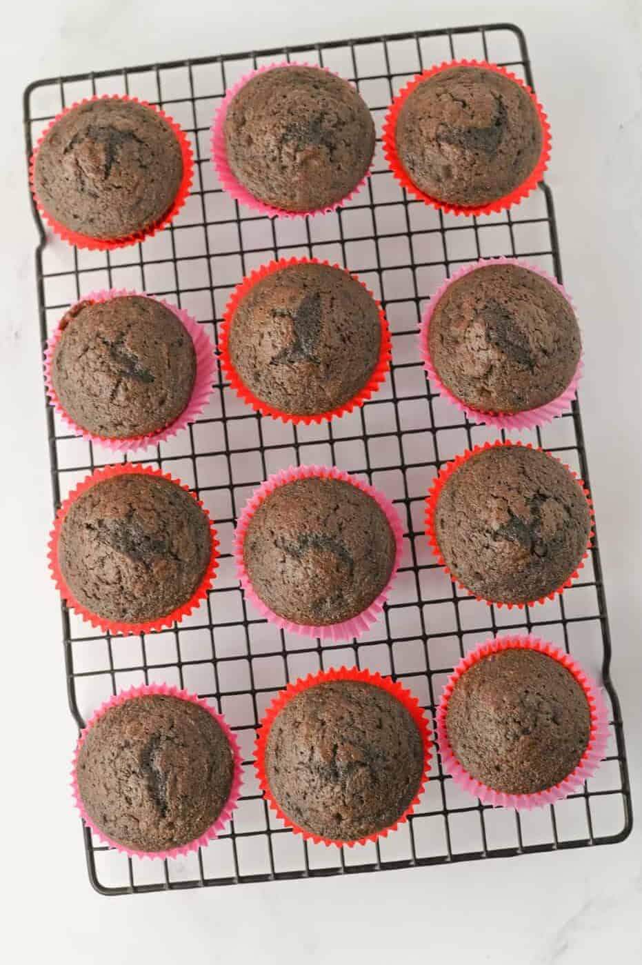 baked chocolate cupcakes on a cooling rack