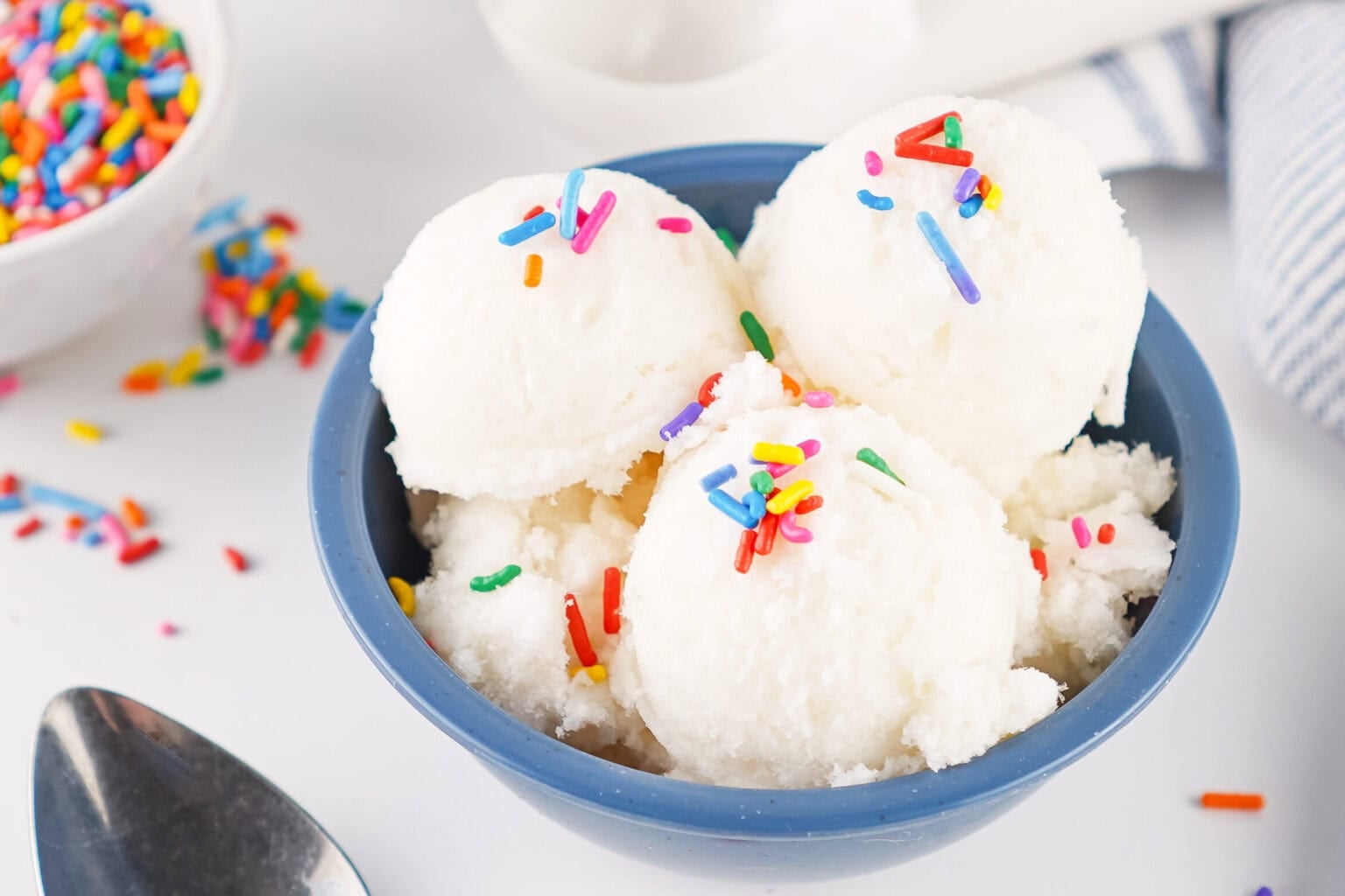 snow ice cream in a blue bowl with sprinkles