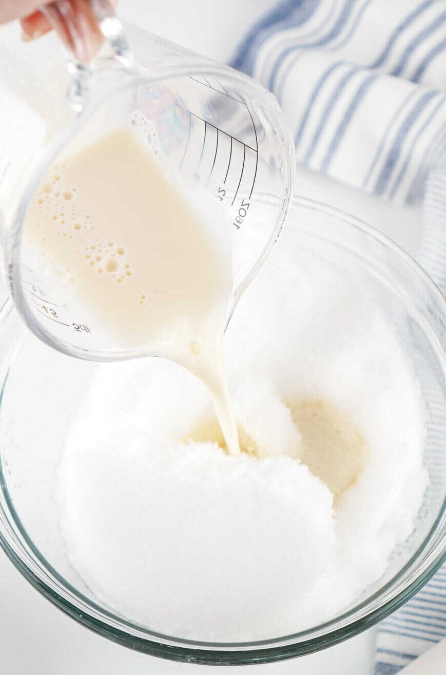 adding milk mixture to bowl