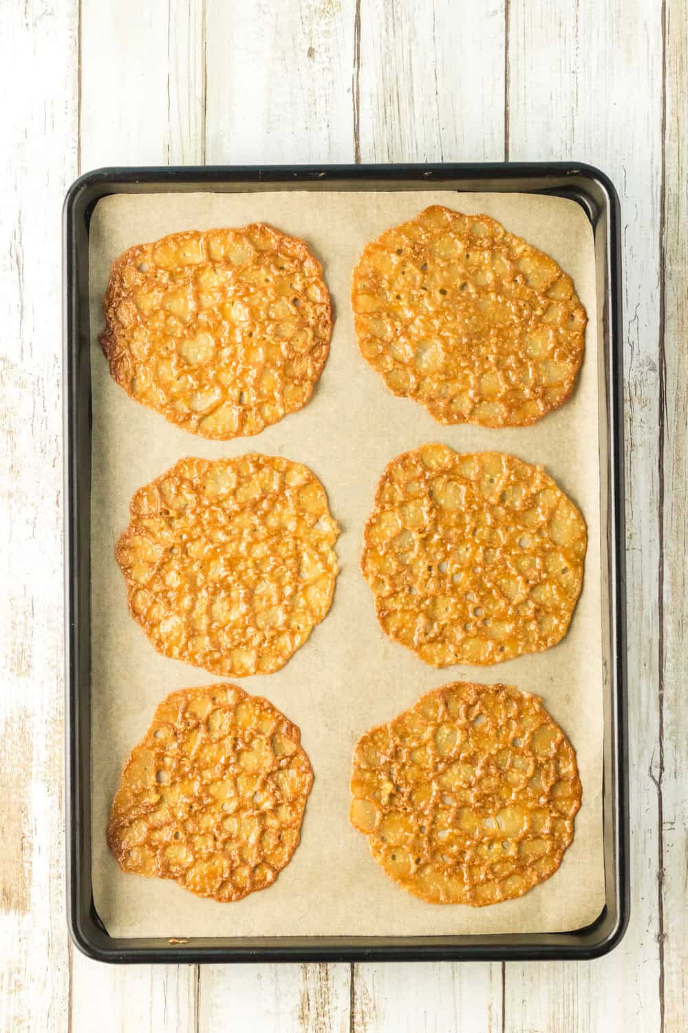 lace cookies on parchment lined pan