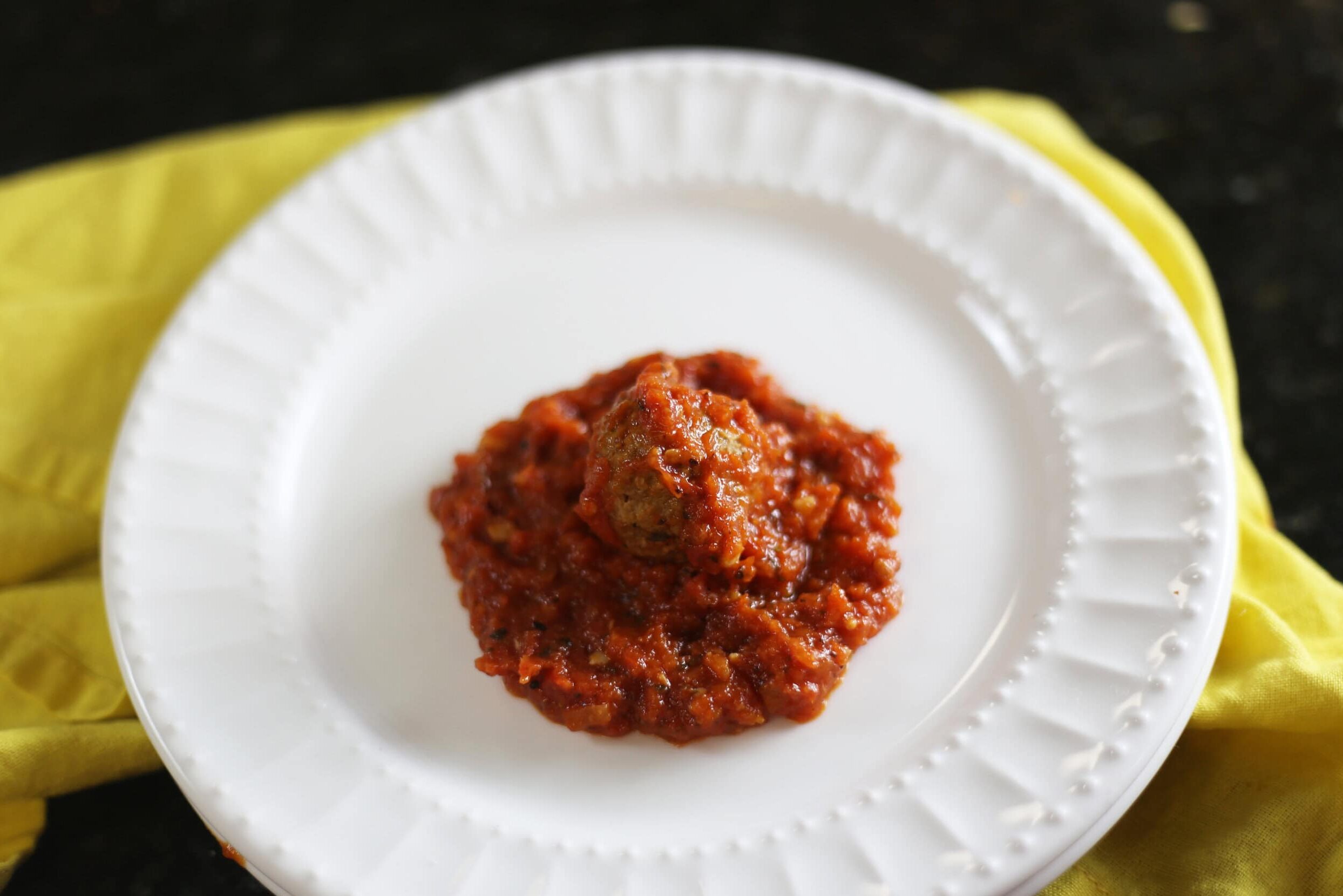 meatball centered in the marinara