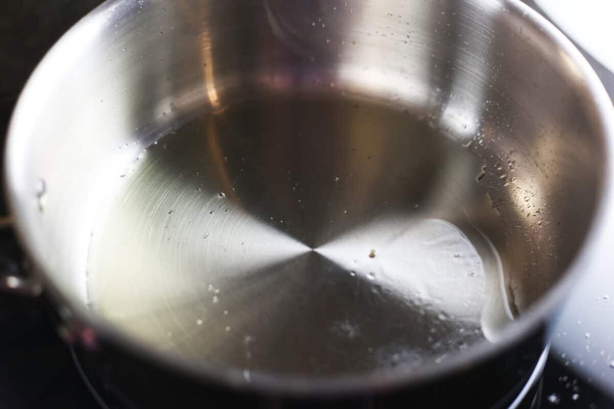 heating olive oil in a skillet