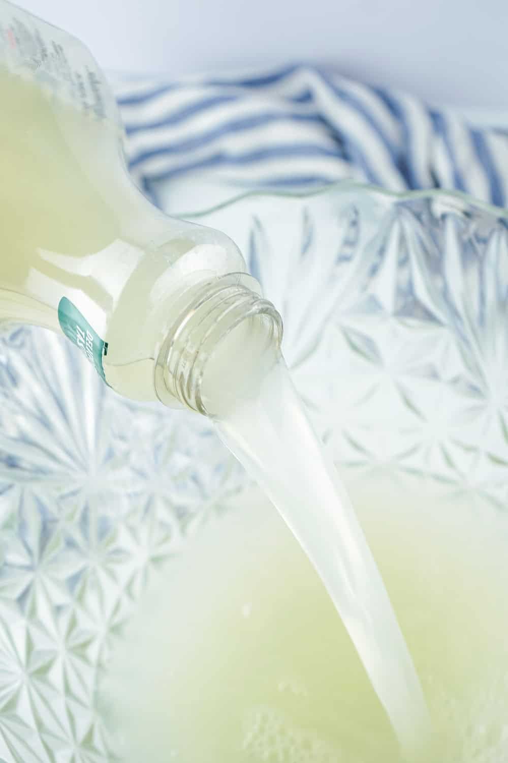 pouring lemonade in punch bowl
