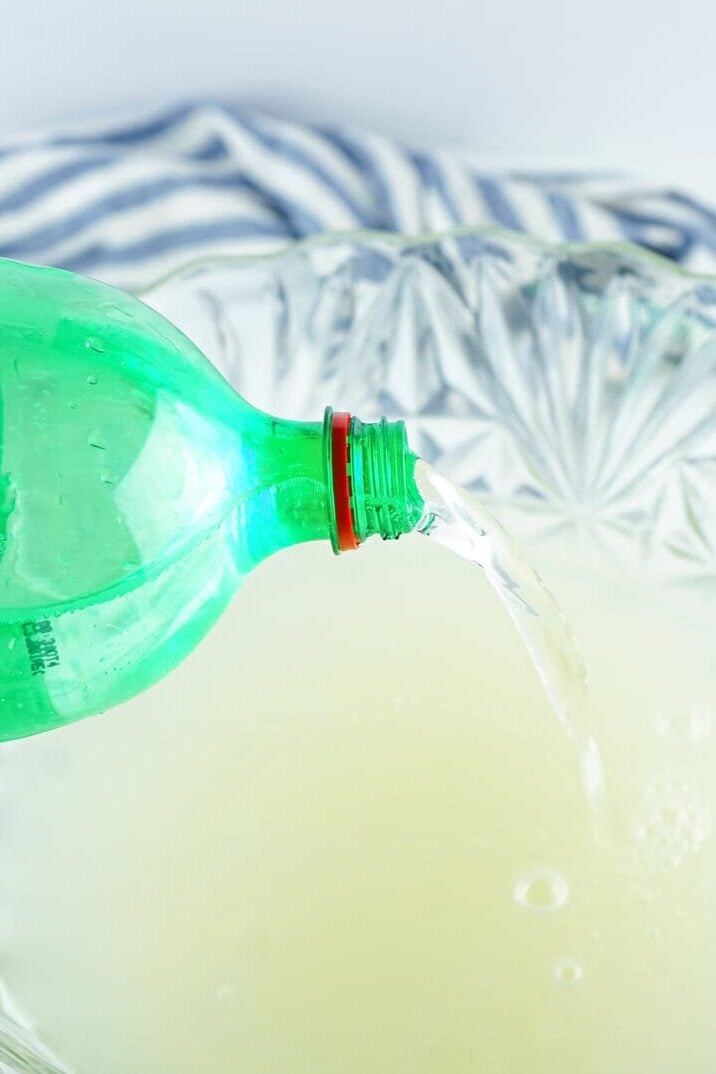 pouring 7up in punch bowl