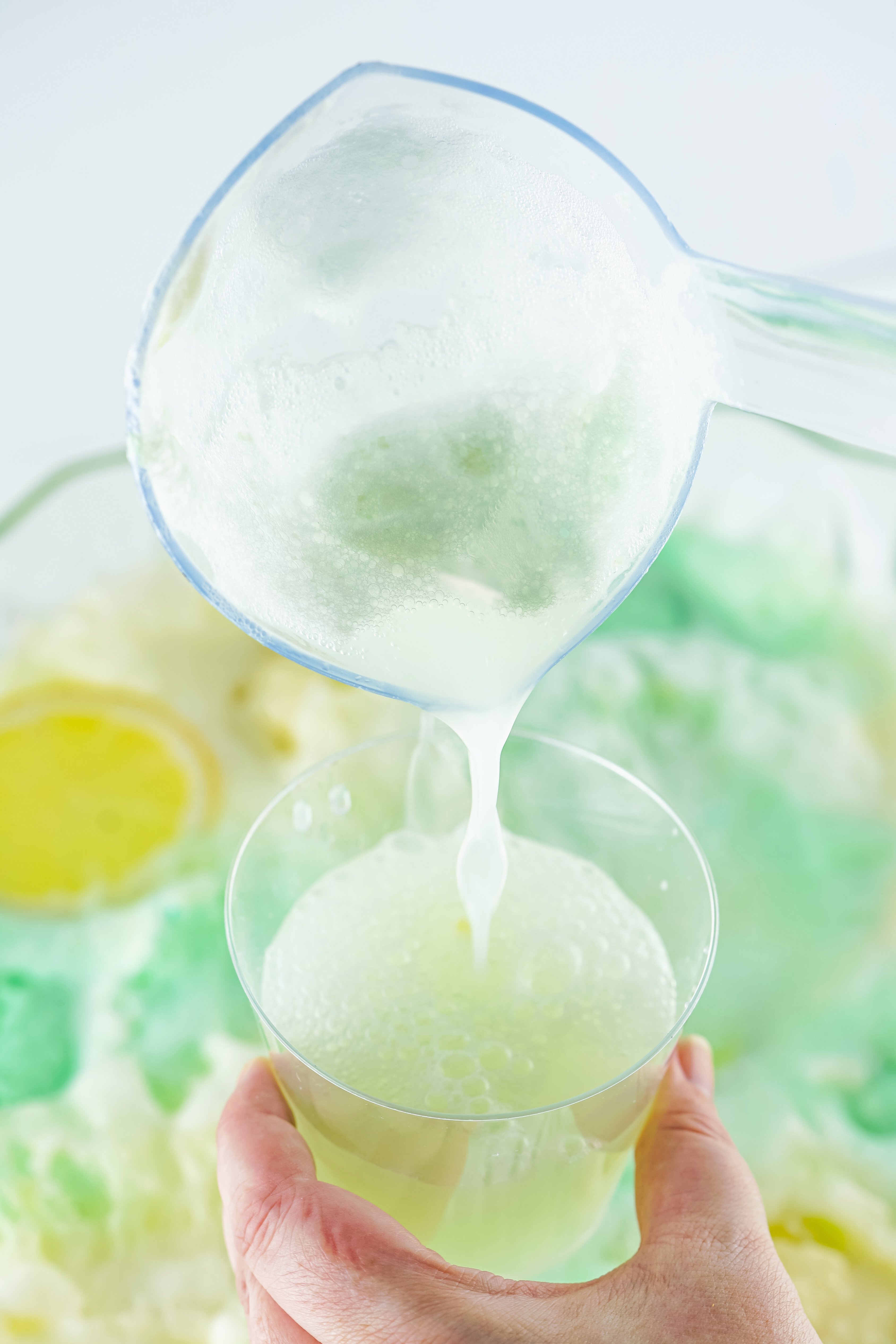 dipping punch with a ladle into a cup