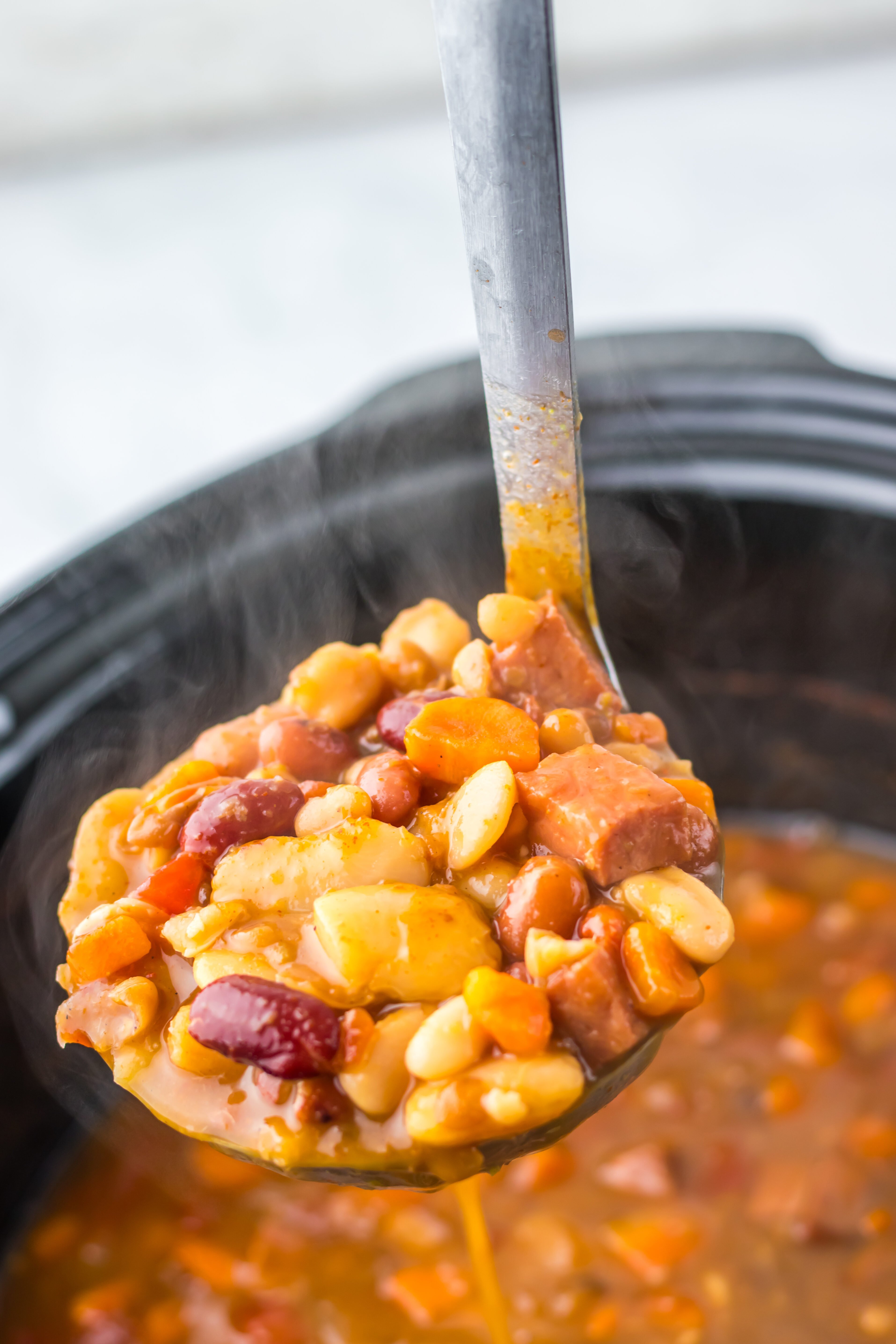 Slow Cooker 15 Bean and Ham Soup in a ladle