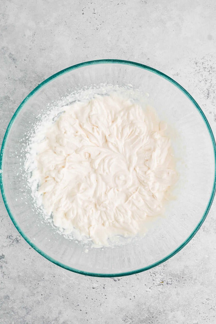 fresh whipped cream in a mixing bowl