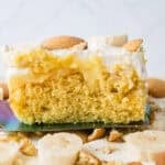 slice of banana pudding poke cake on a spatula