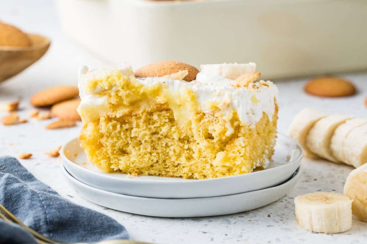 slice of banana pudding poke cake on a serving plate