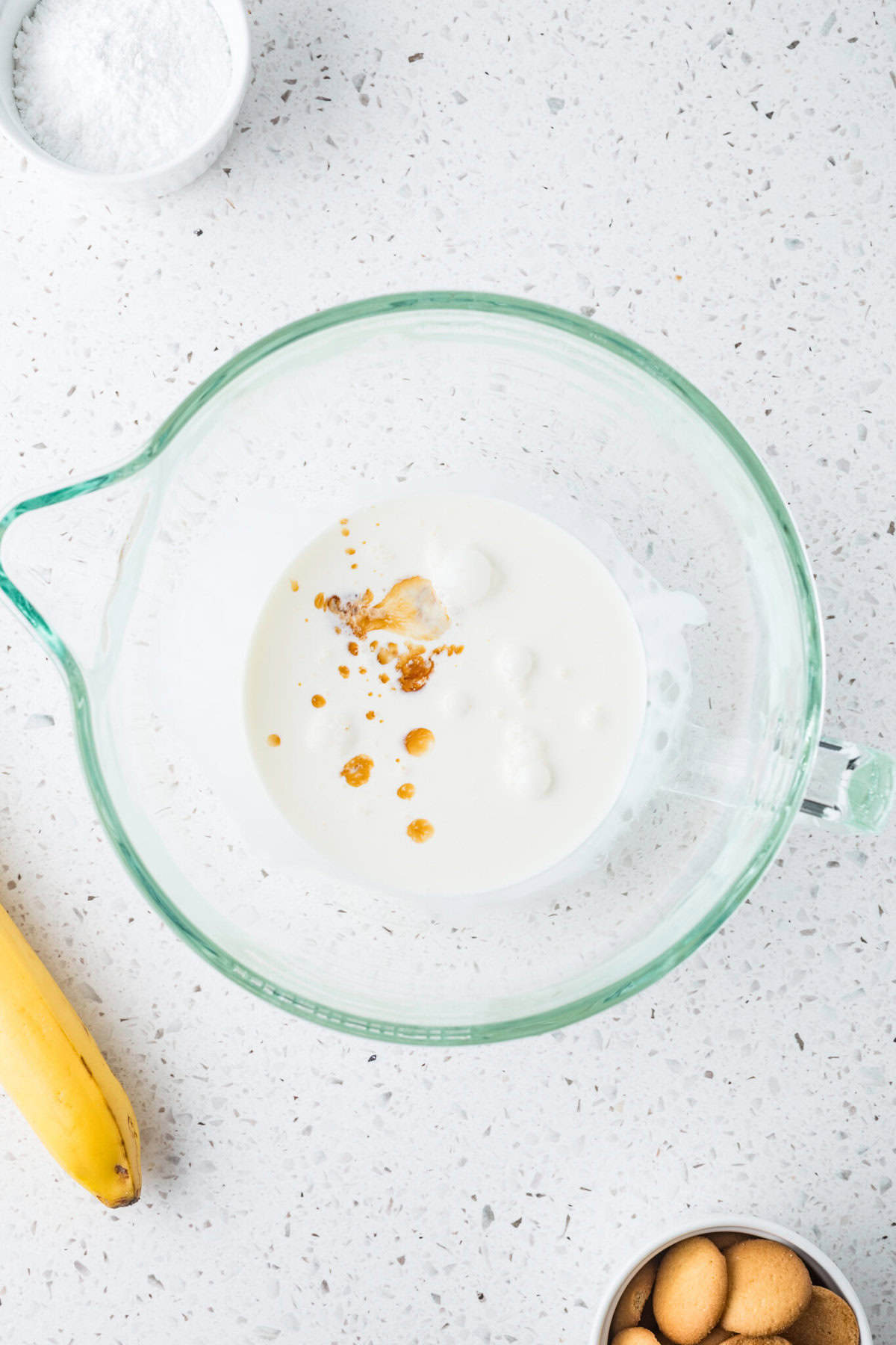 heavy cream and vanilla in a mixing bowl