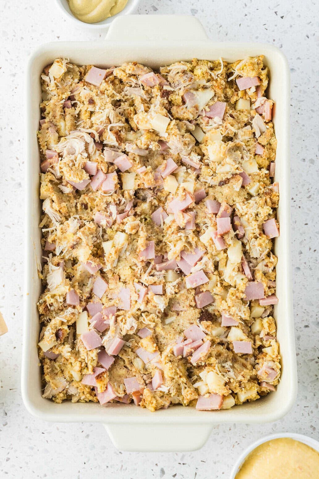 mixed up chicken cordon bleu casserole spread in a baking dish