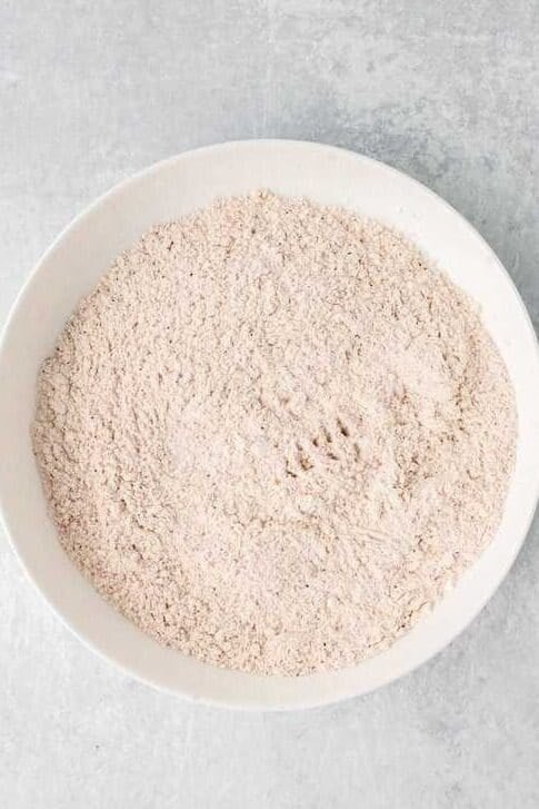 mixed up flour and seasonings for corn flakes chicken