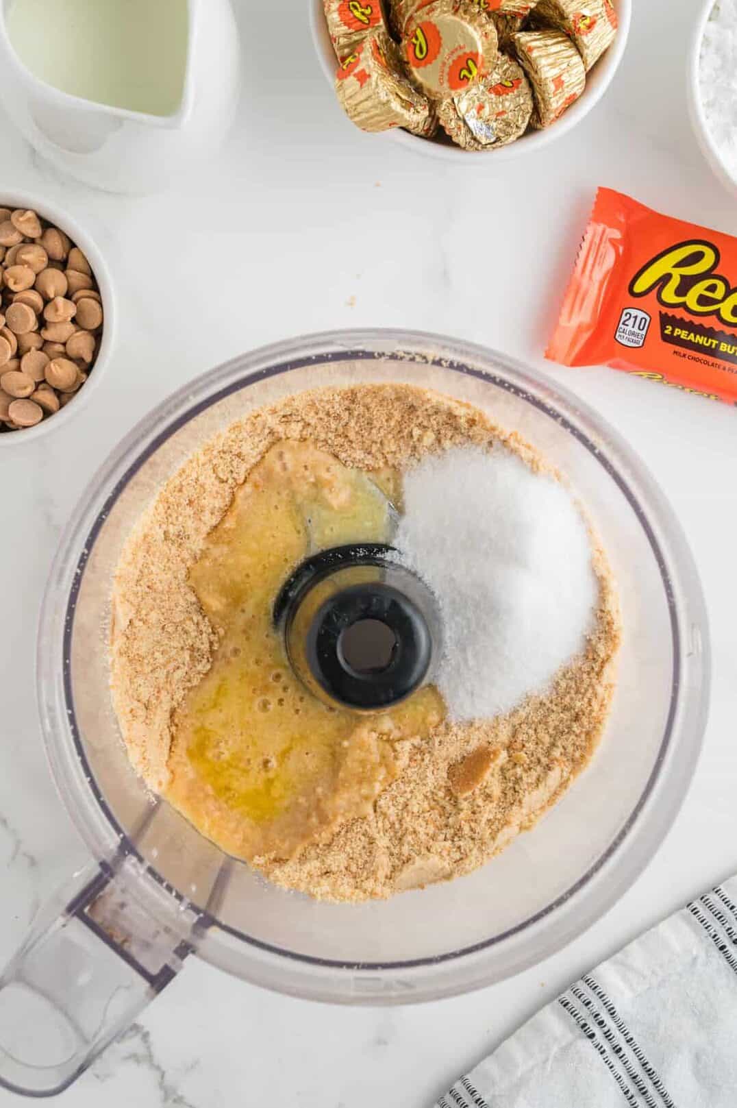 butter and sugar added to crushed vanilla wafers in the food processor