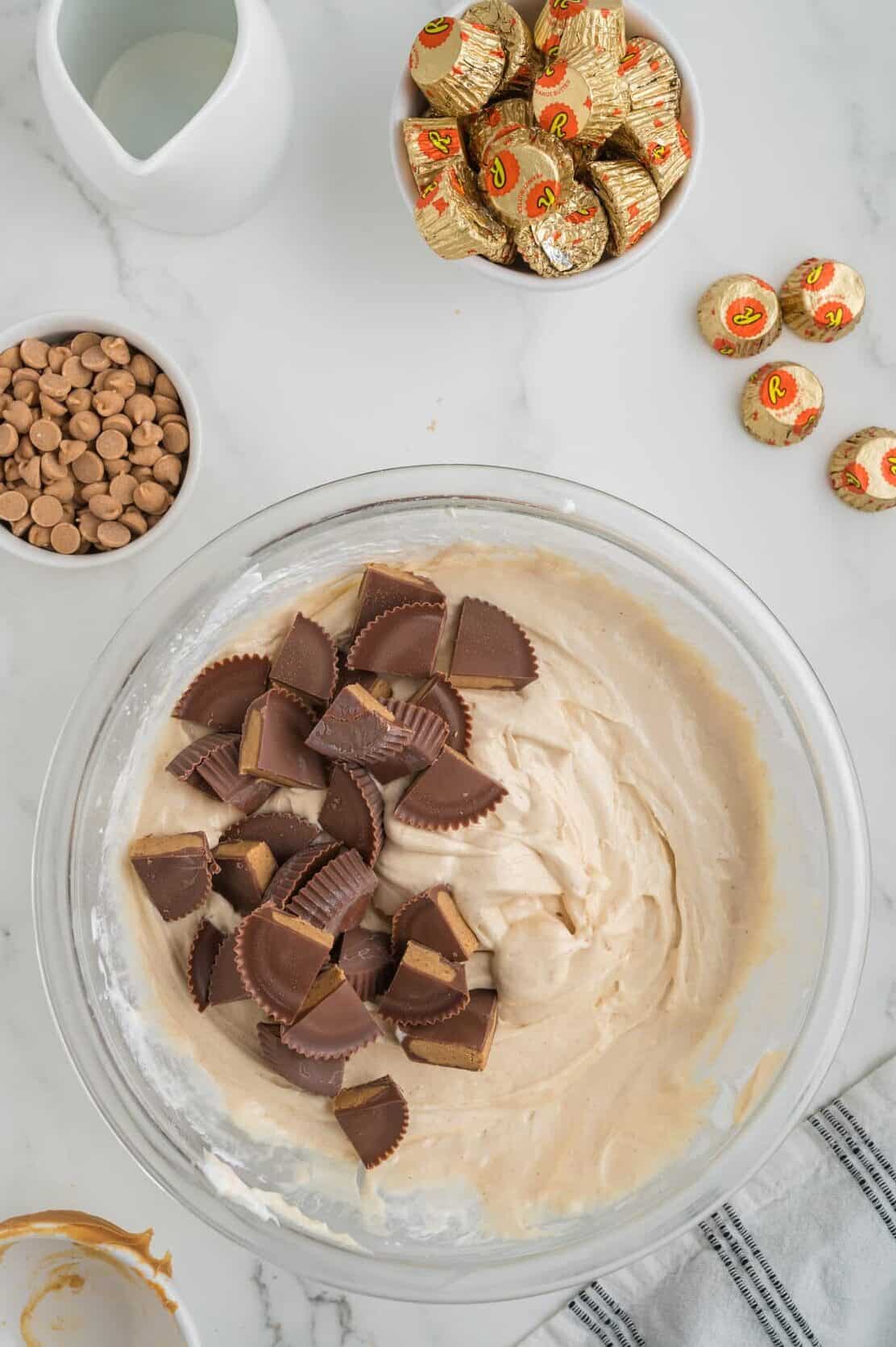 chopped reese's cups in peanut buttter pie filling mixture