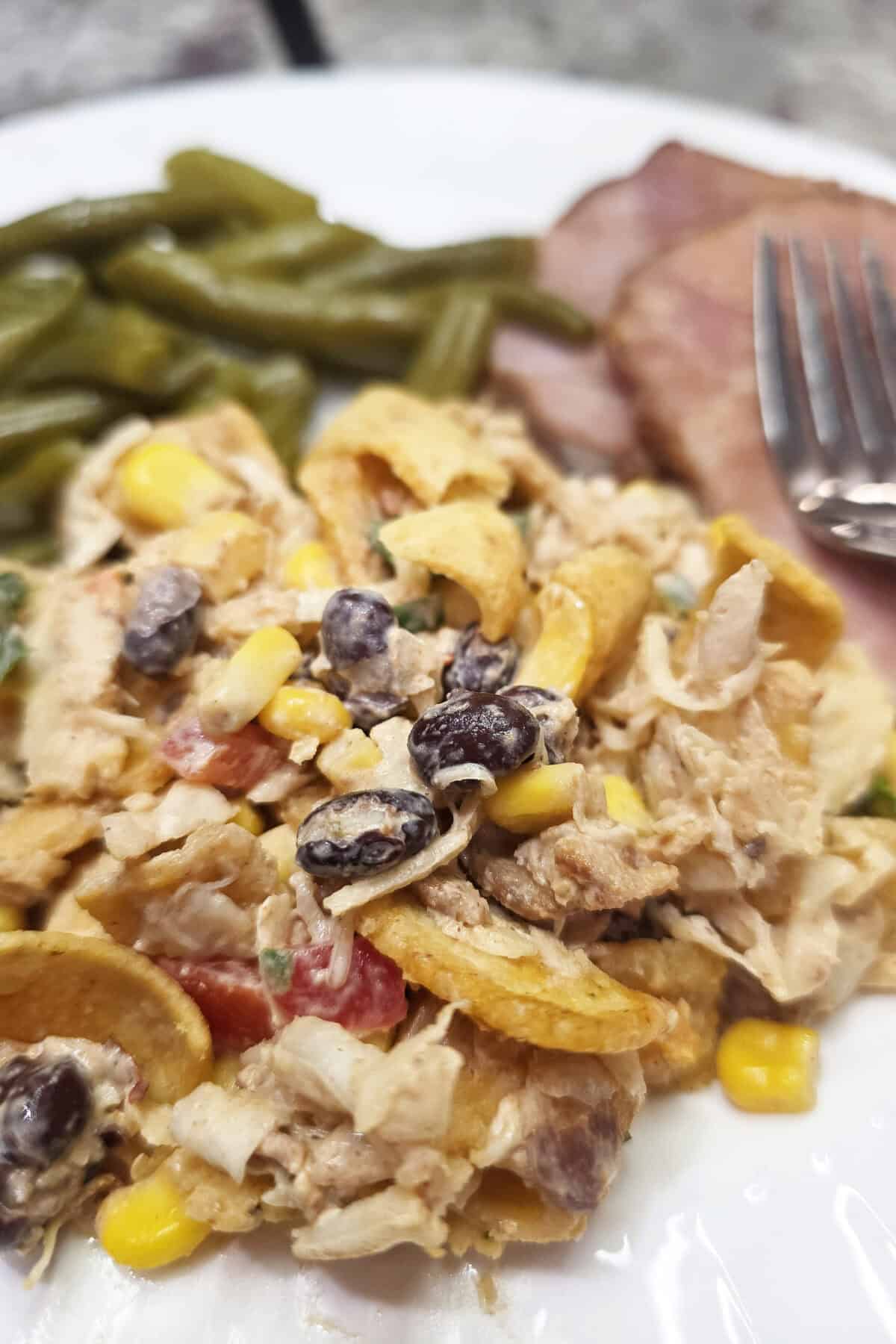cowboy coleslaw on a plate with ham and green beans