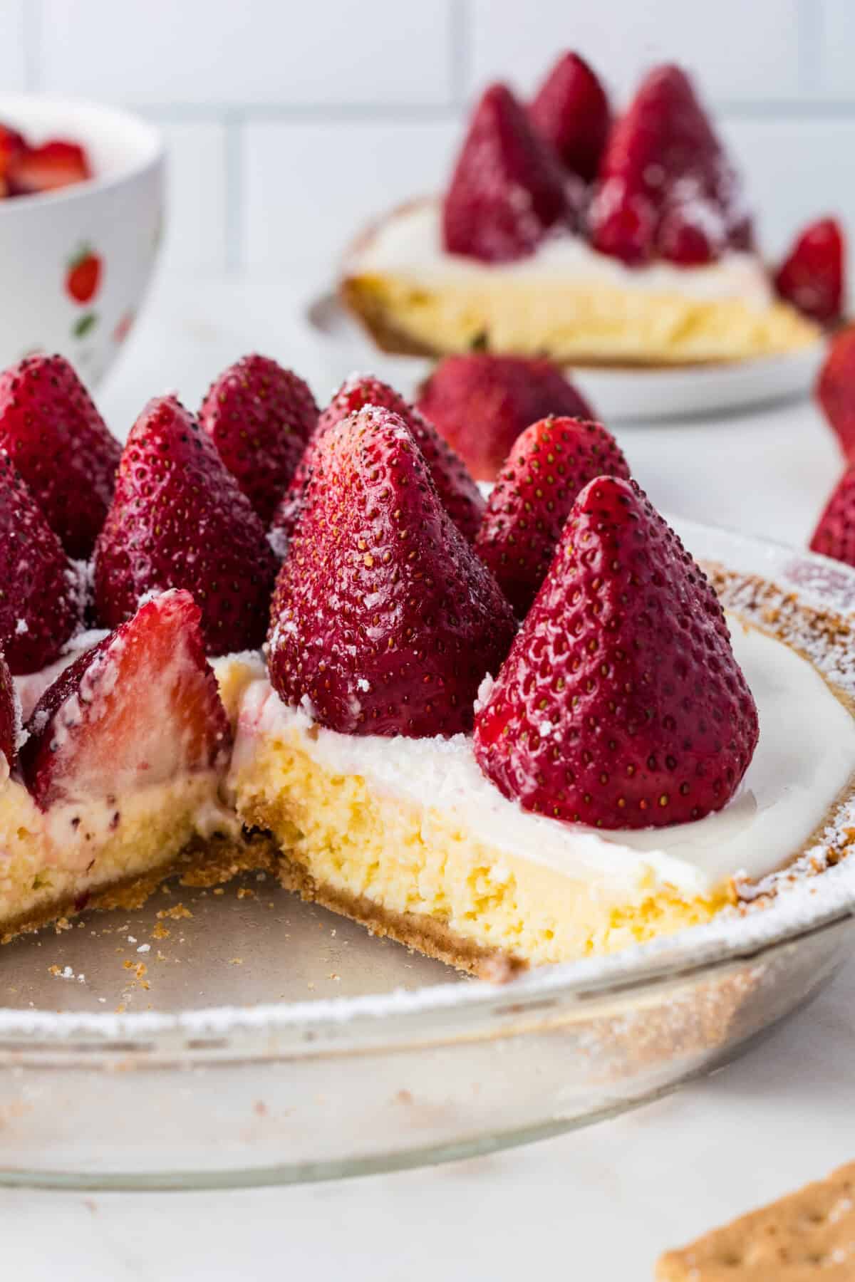 Strawberry Cheesecake Pie with a slice missing