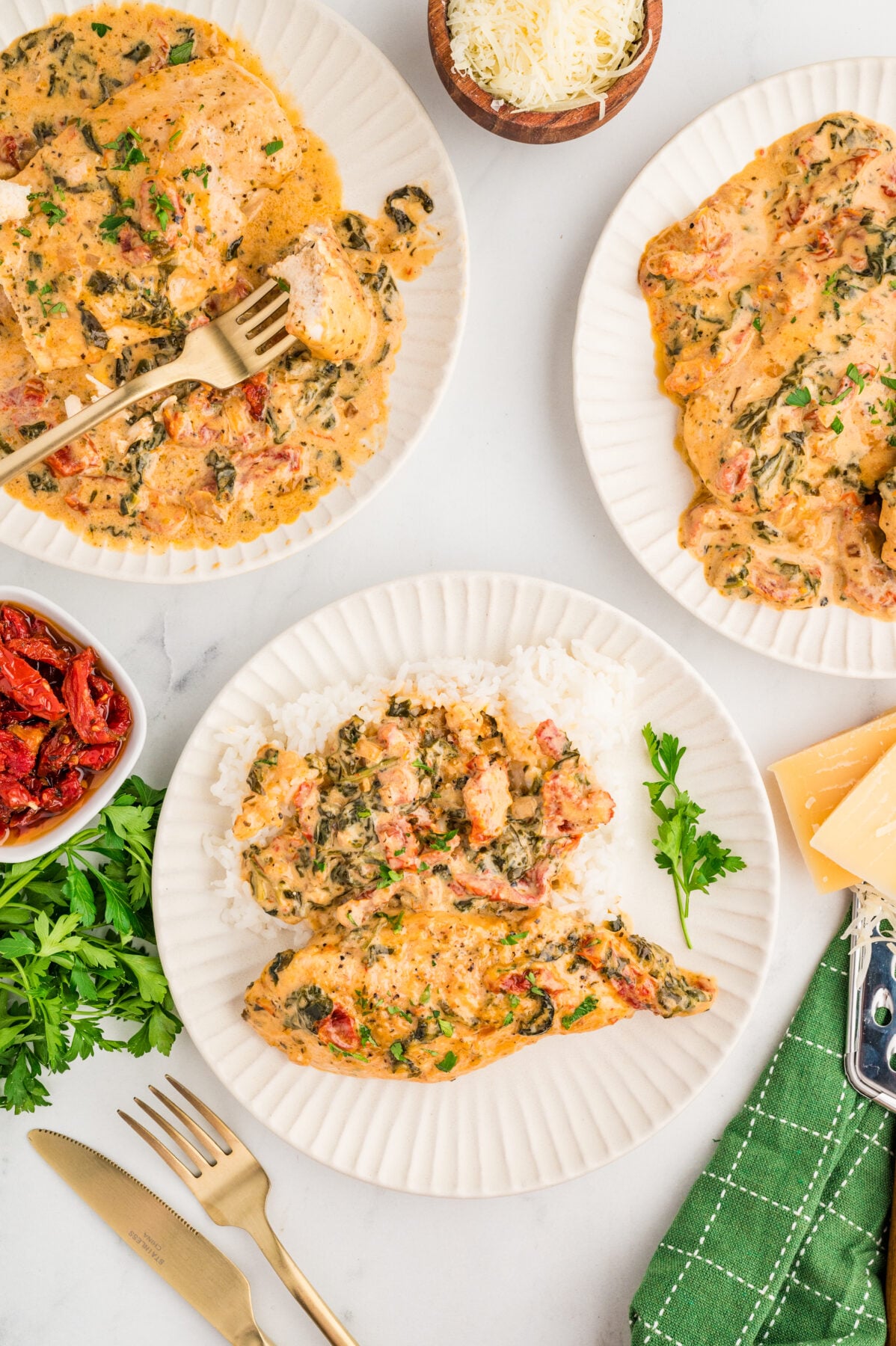 creamy tuscan chicken on plates