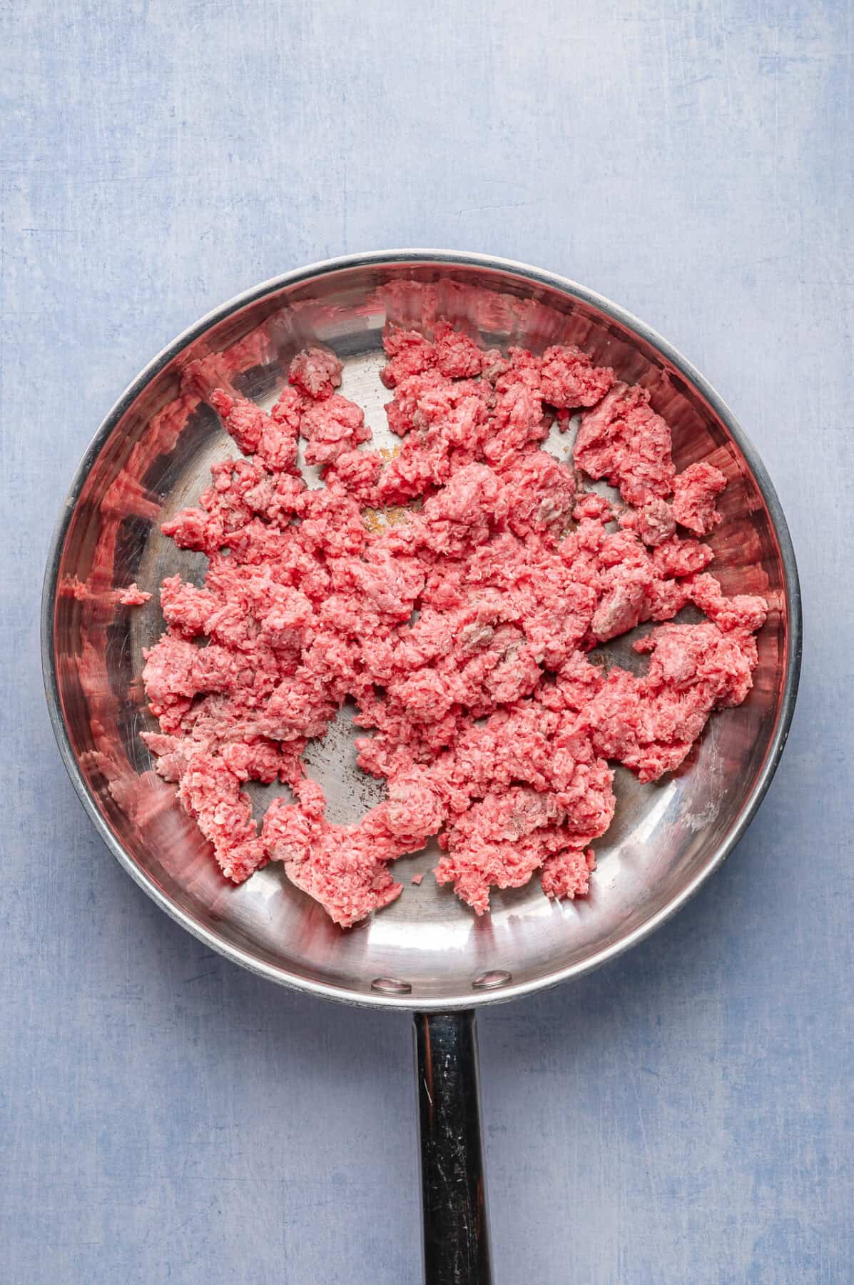 raw ground beef in skillet