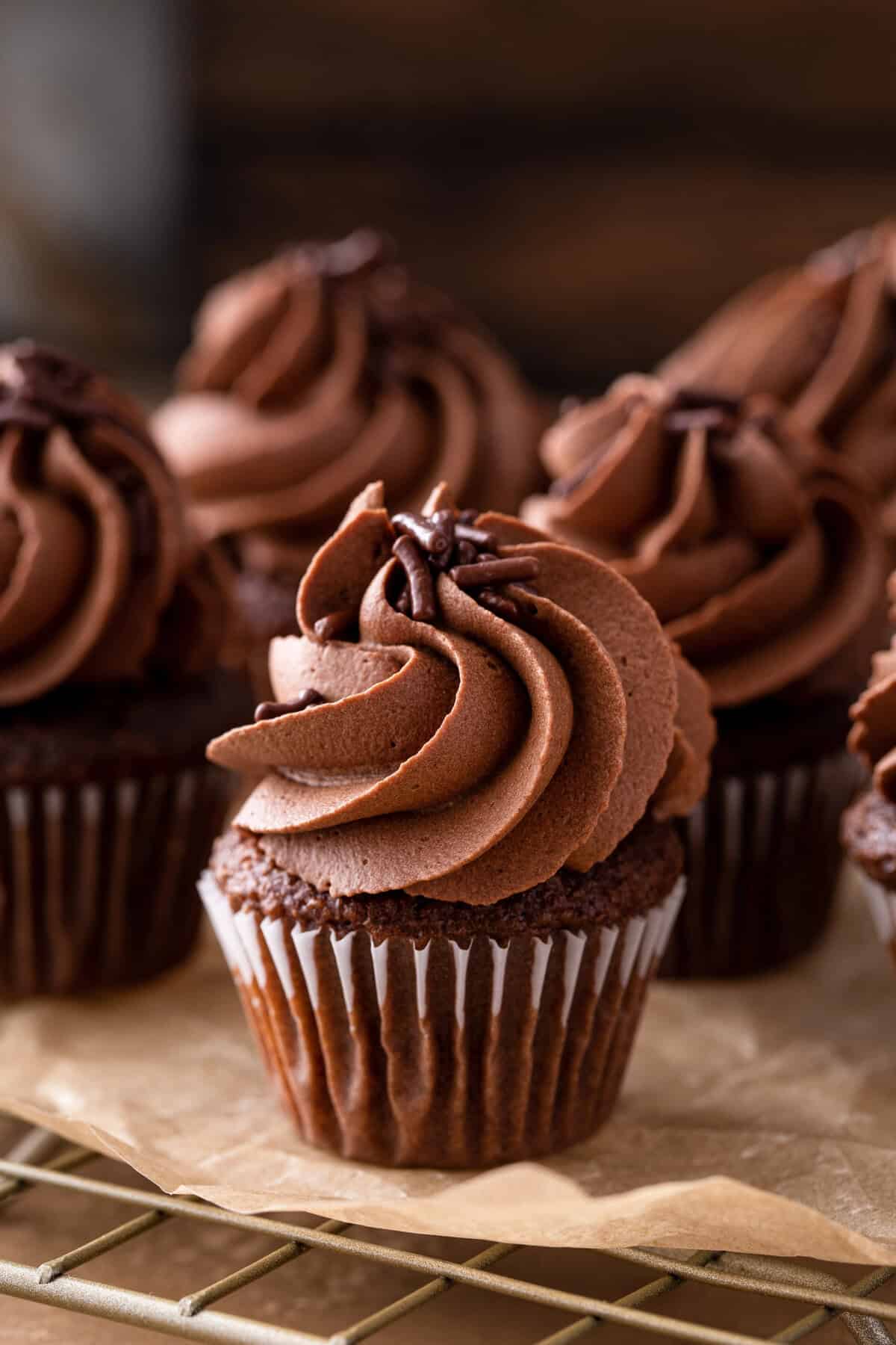 whipped ganache piped on cupcakes