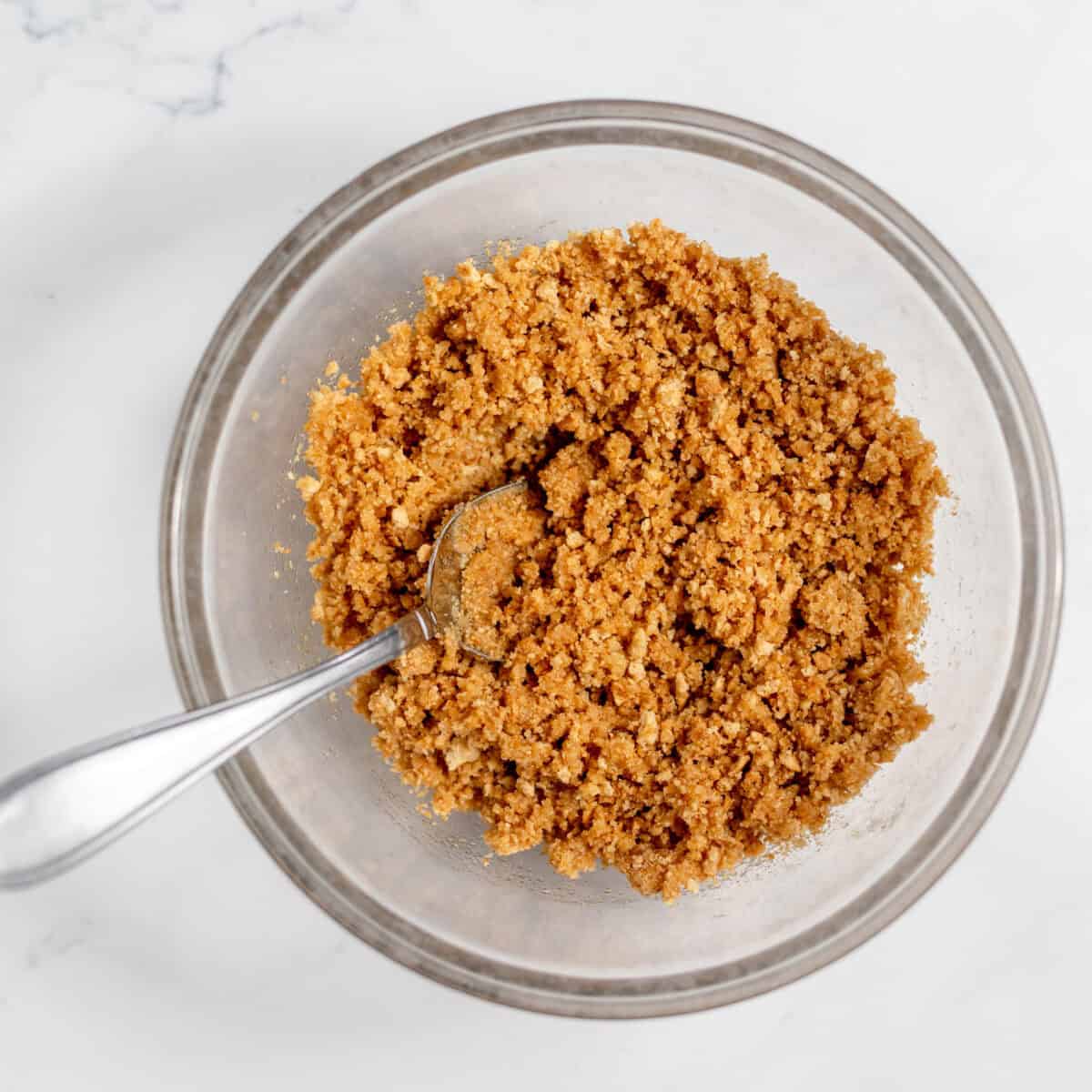 graham cracker crumbs and sugar mixed in a bowl