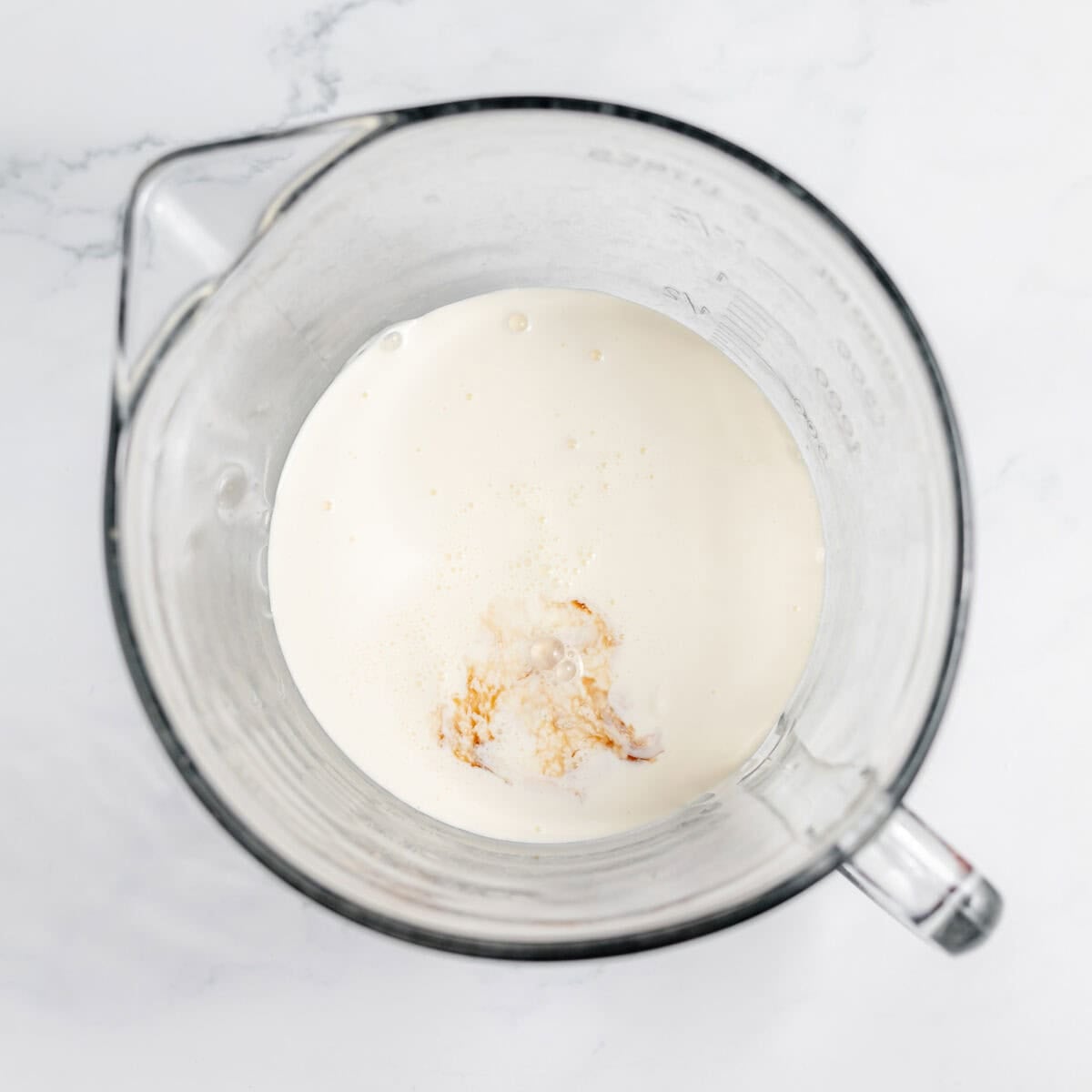 heavy cream and vanilla in a mixing bowl
