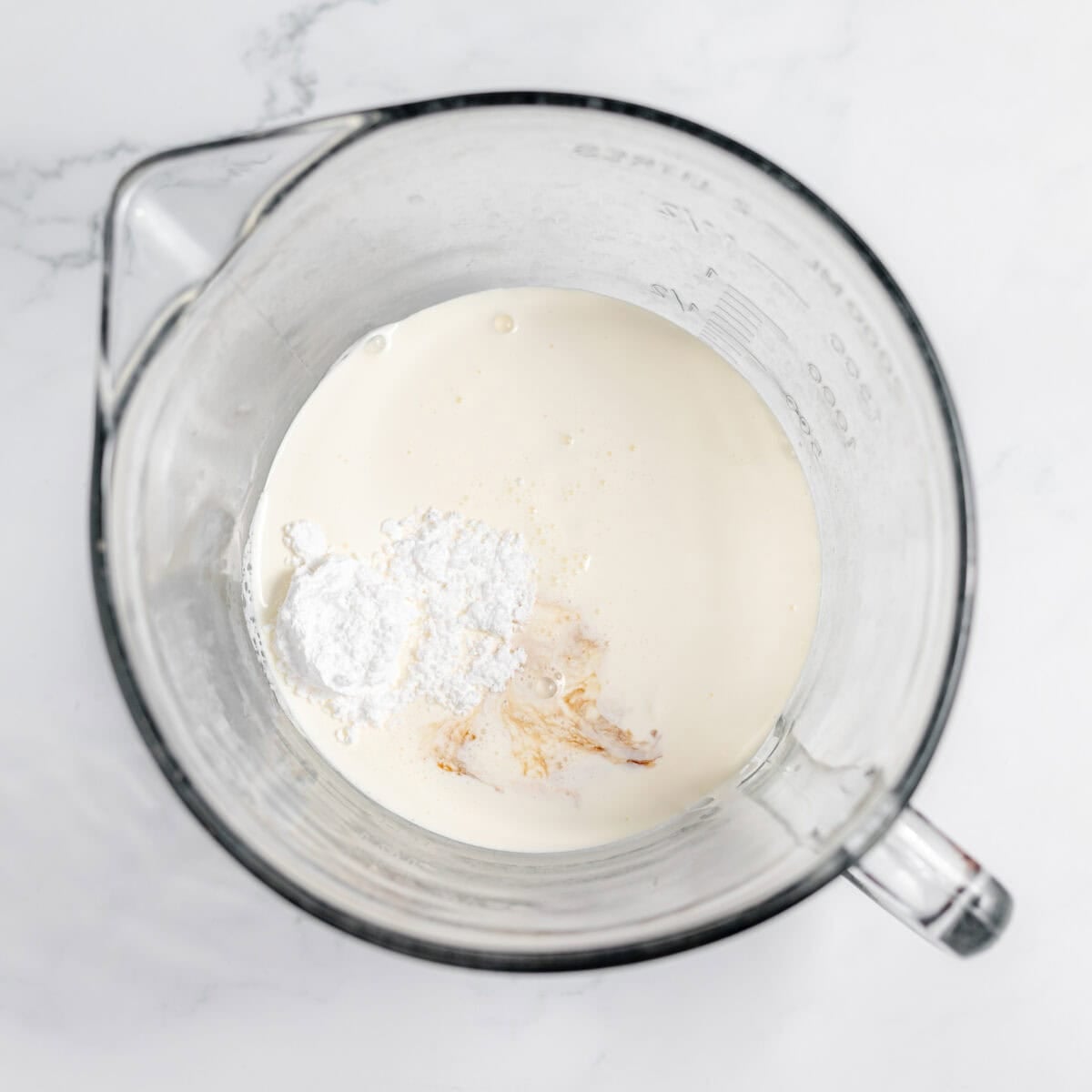 heavy cream, vanilla and powdered sugar in a mixing bowl