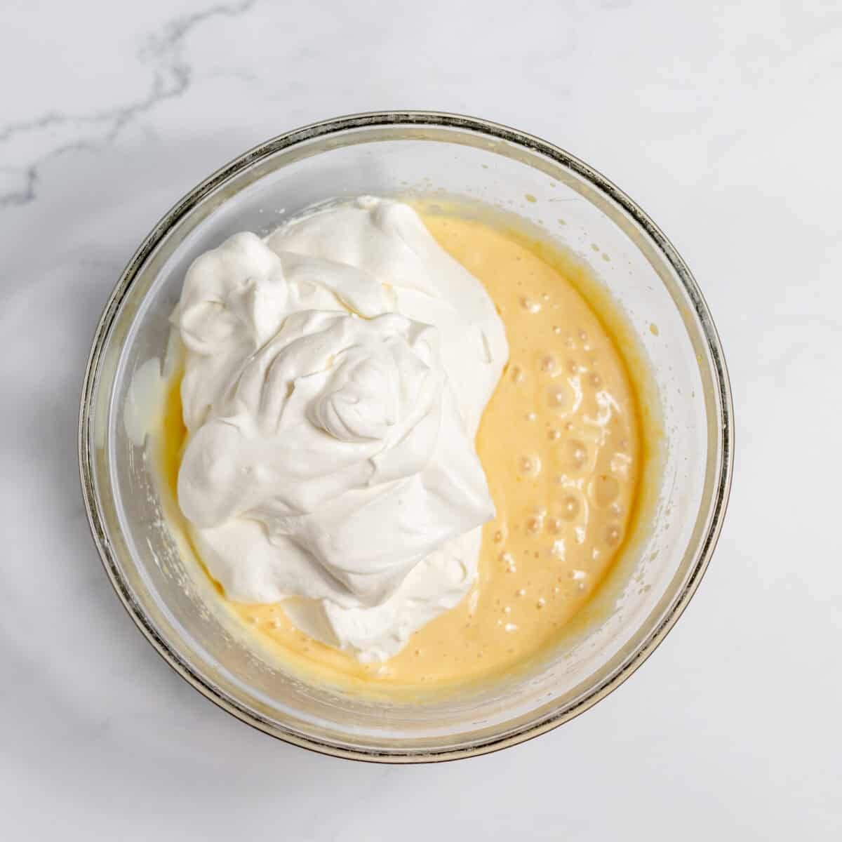 orange juice mixture with whipped cream added
