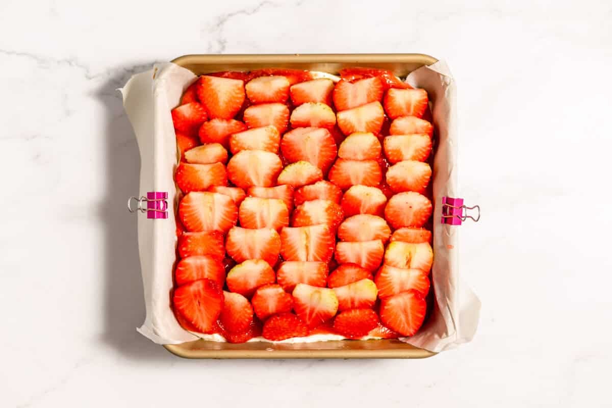 fresh strawberries layered in the pan