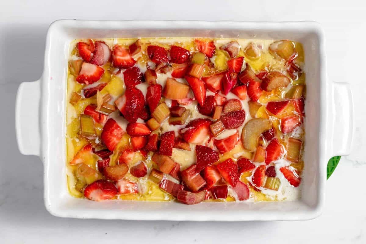 fruit and cobbler batter in baking dish