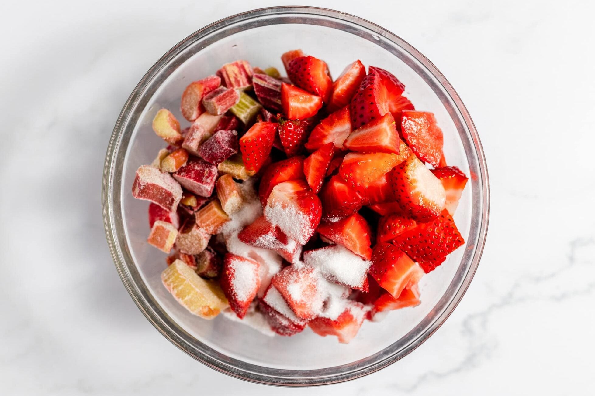 strawberries, rhubarb, and sugar in bowl