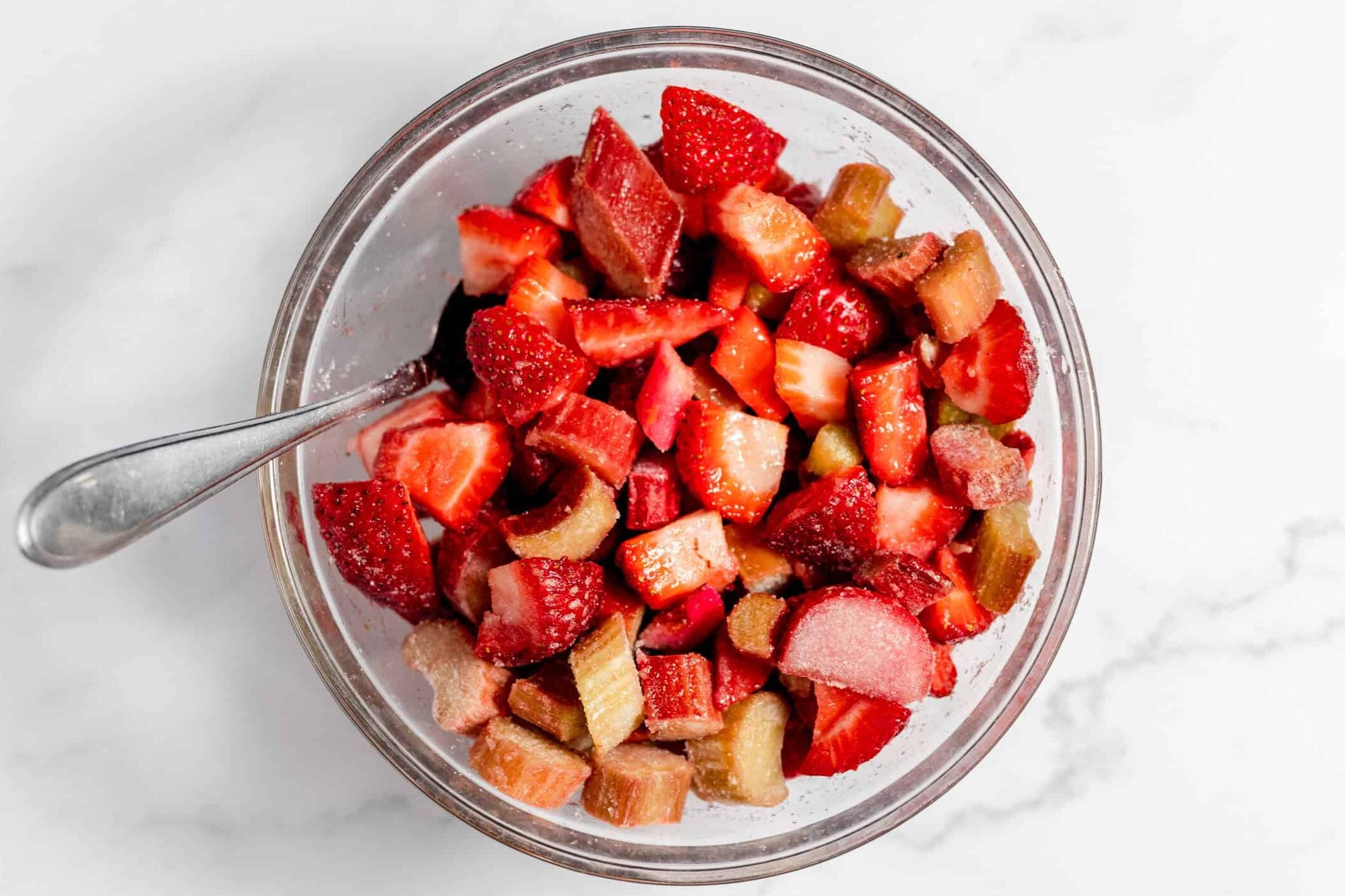strawberries, rhubarb, and sugar in bowl