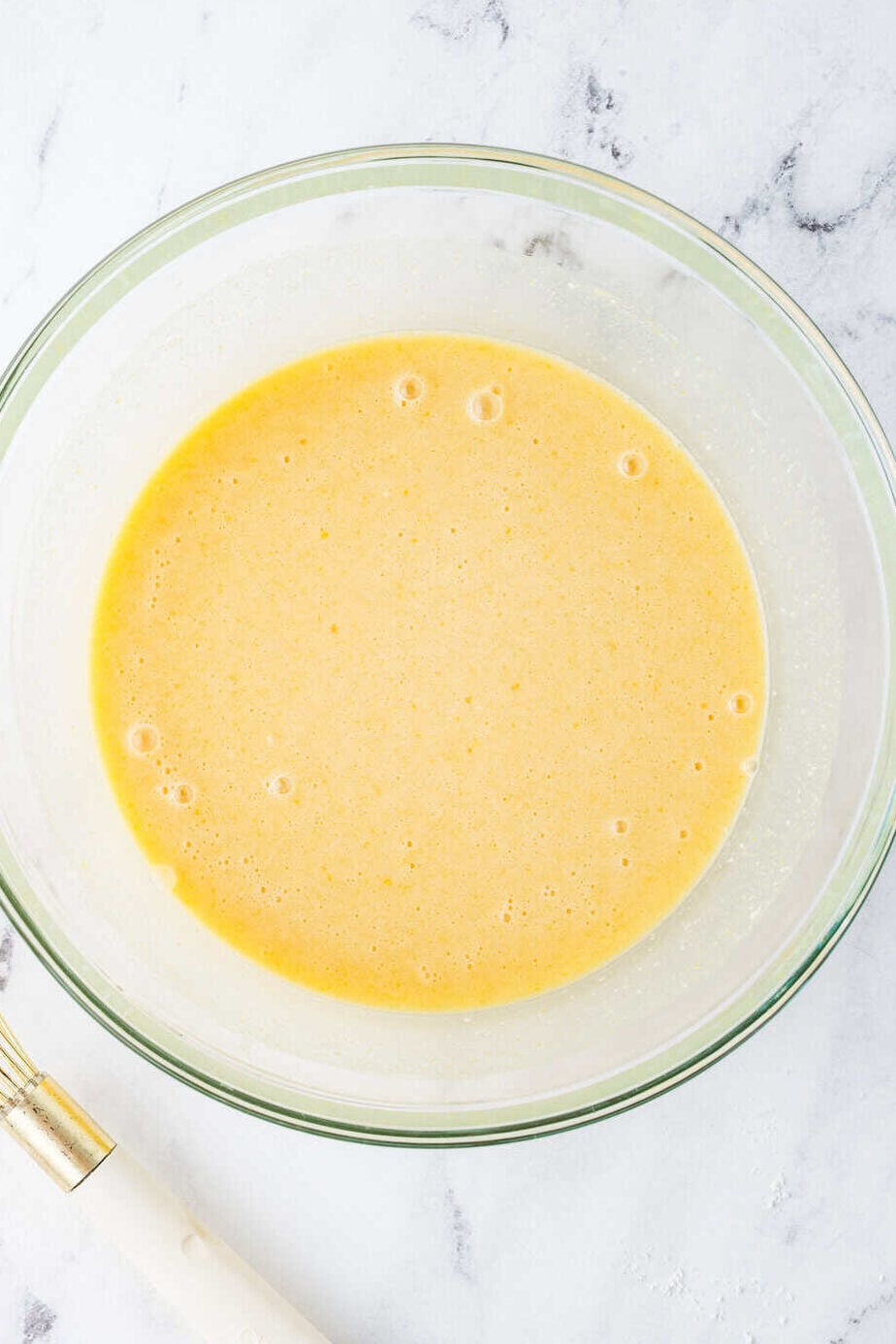 buttermilk pie ingredients mixed up in a mixing bowl