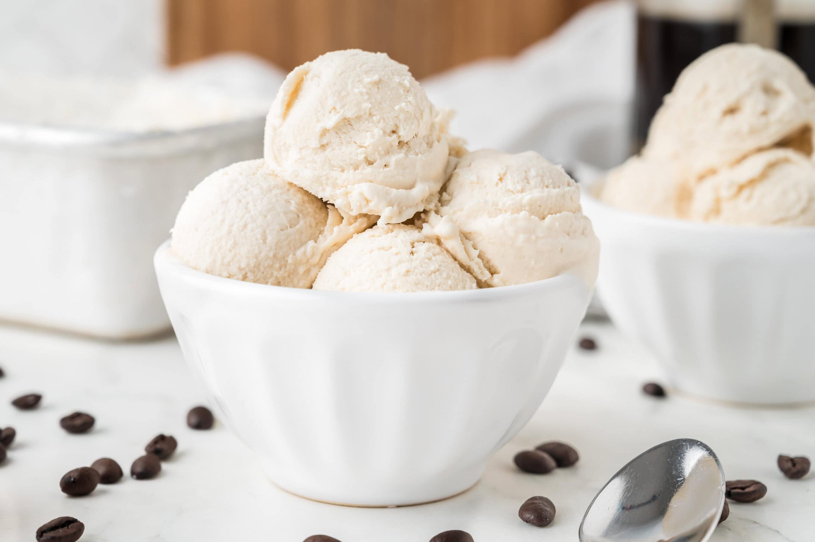 scoops of coffee ice cream in a white bowl