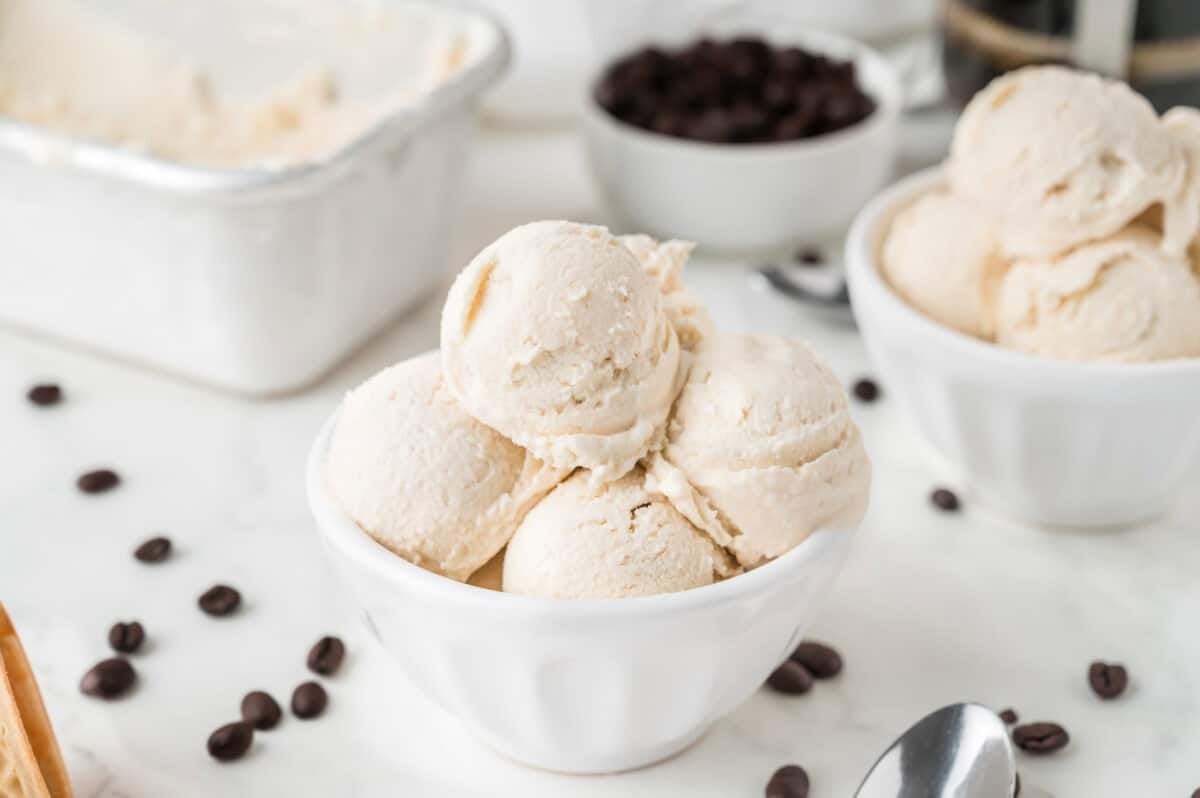 scoops of coffee ice cream in a white bowl