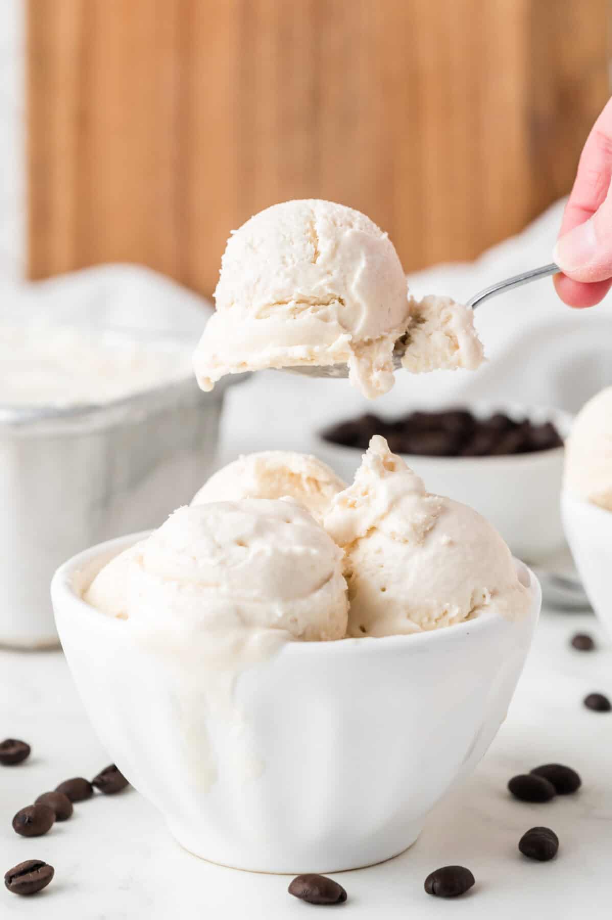 coffee ice cream in a bowl being scooped out